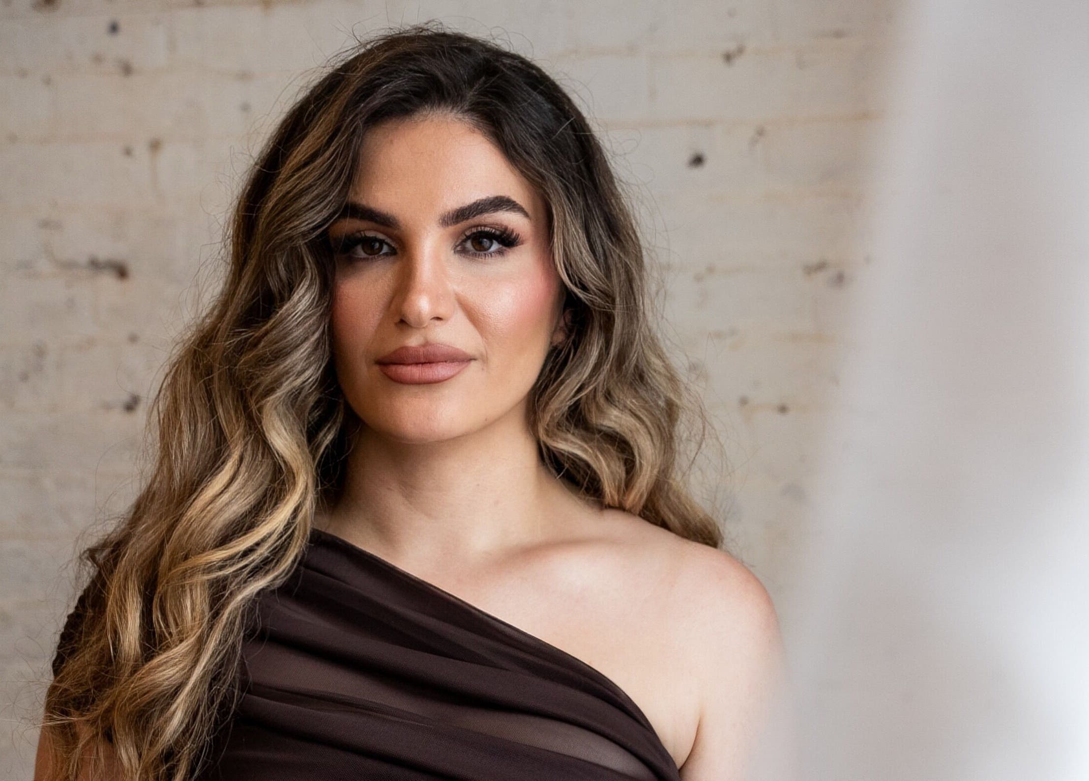 Elegant client at Atah’s Elegance, Hamilton, Ontario, CA, showcasing professional beauty services.