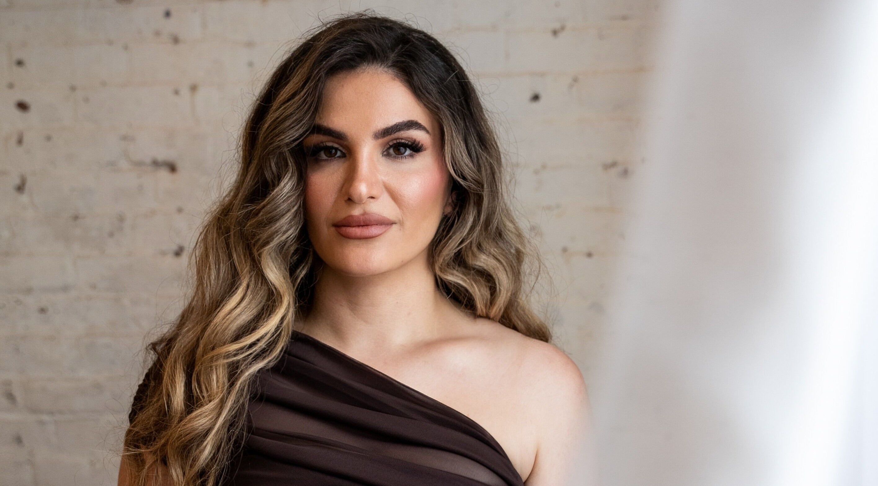 Elegant client at Atah’s Elegance, Hamilton, Ontario, CA, showcasing professional beauty services.