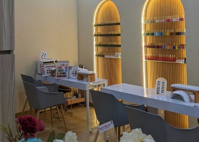 Chic nail studio at MD Beauty Lash in Jawa Barat, ID, features sleek tables and vibrant polish displays.