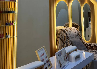 MD Beauty Lash elegant nail salon interior in Jawa Barat, ID with mirrors and cozy chairs.