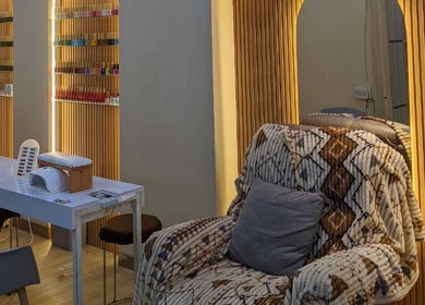 Cozy seating area at MD Beauty Lash, Jawa Barat, Jawa Barat, ID, with nail polish display and chic decor.