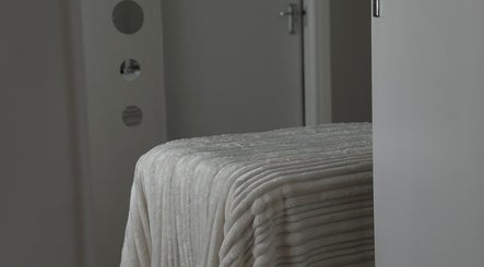 Elegant treatment room at Aesthetic Aura, Randburg, Gauteng, ZA with plush massage bed.