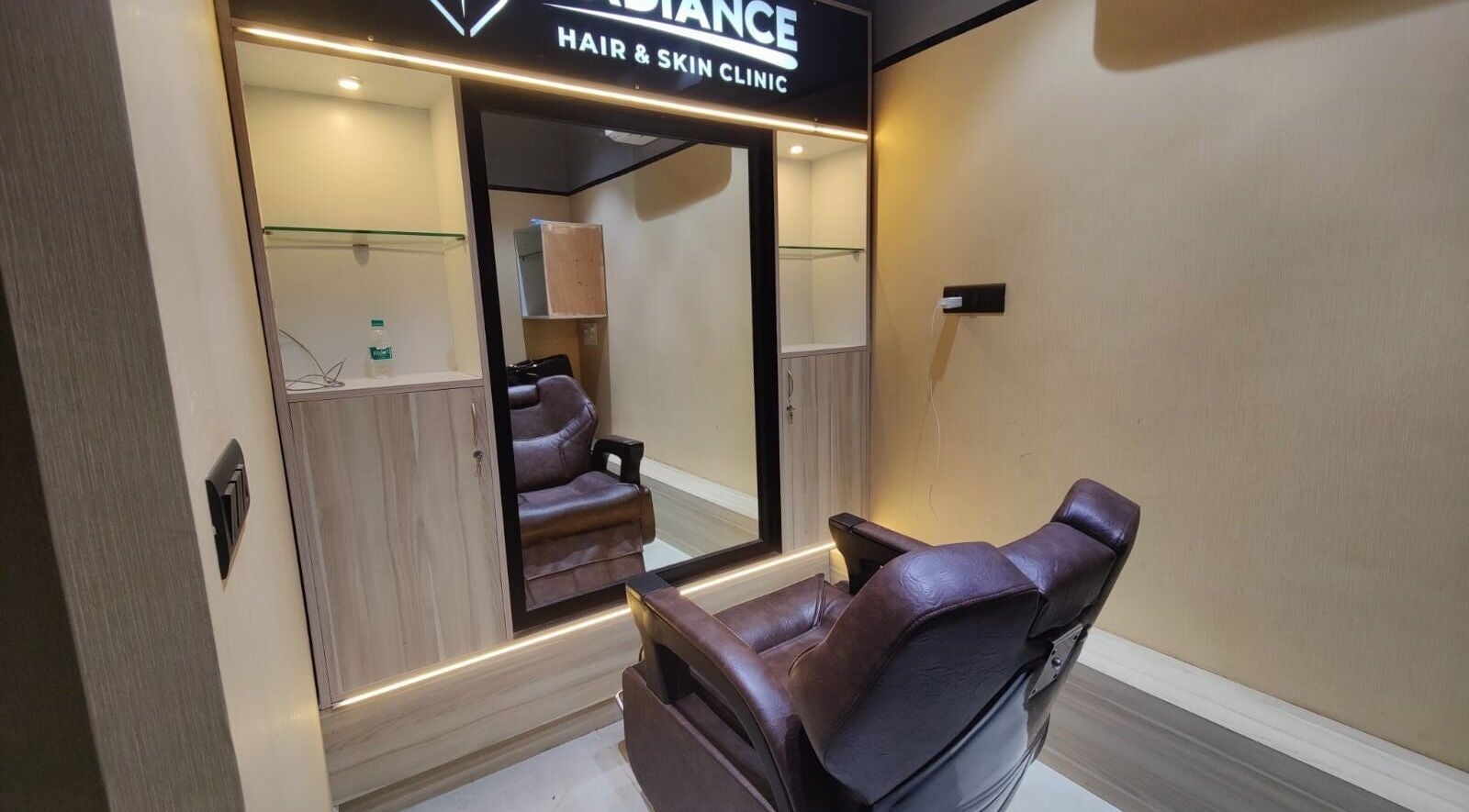 Chic treatment room at Radiance Hair and Skin Clinic, New Delhi, Delhi, IN featuring a plush chair and elegant decor.