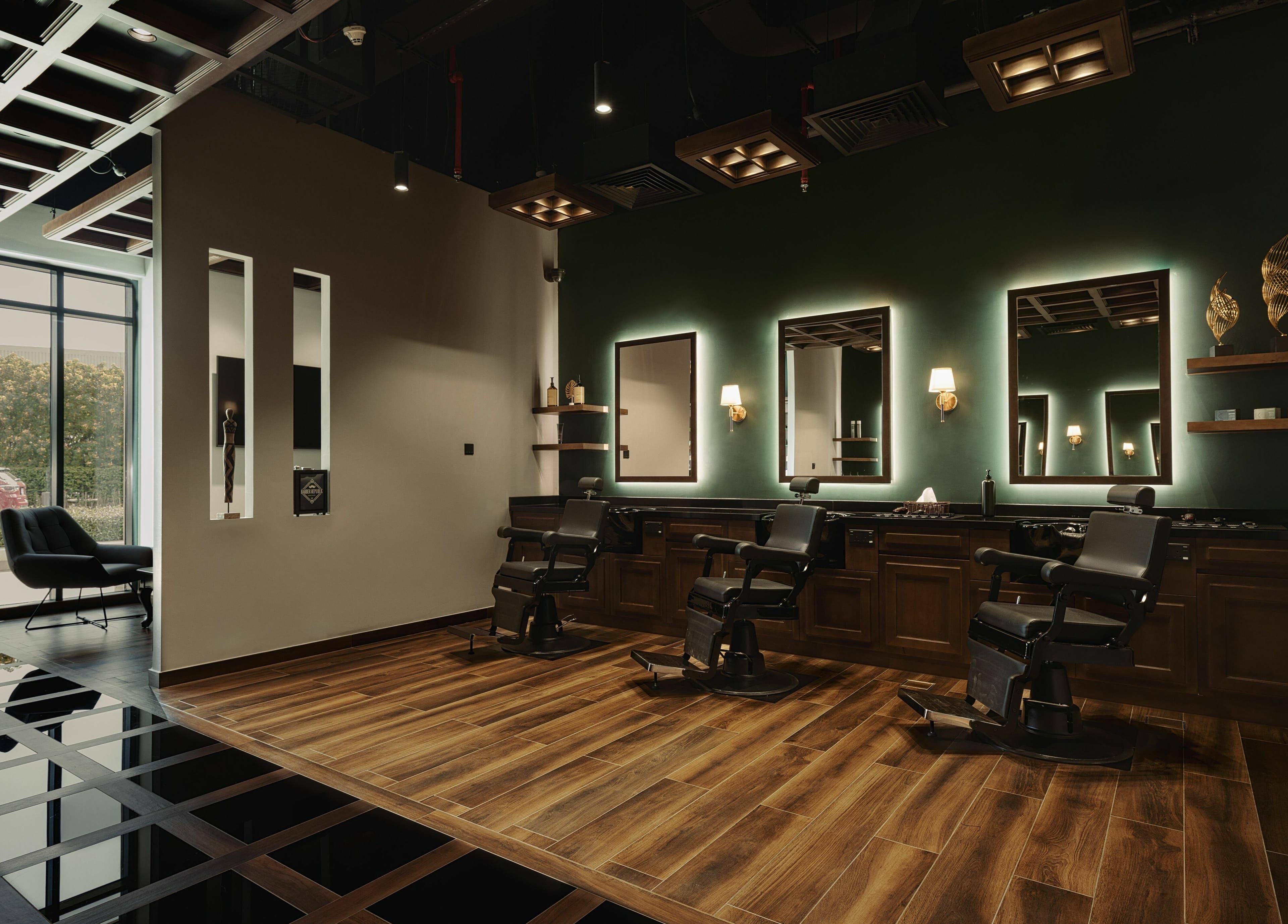 Stylish interior of Barber Republic Gents Saloon in Dubai, AE with modern chairs and lighting.
