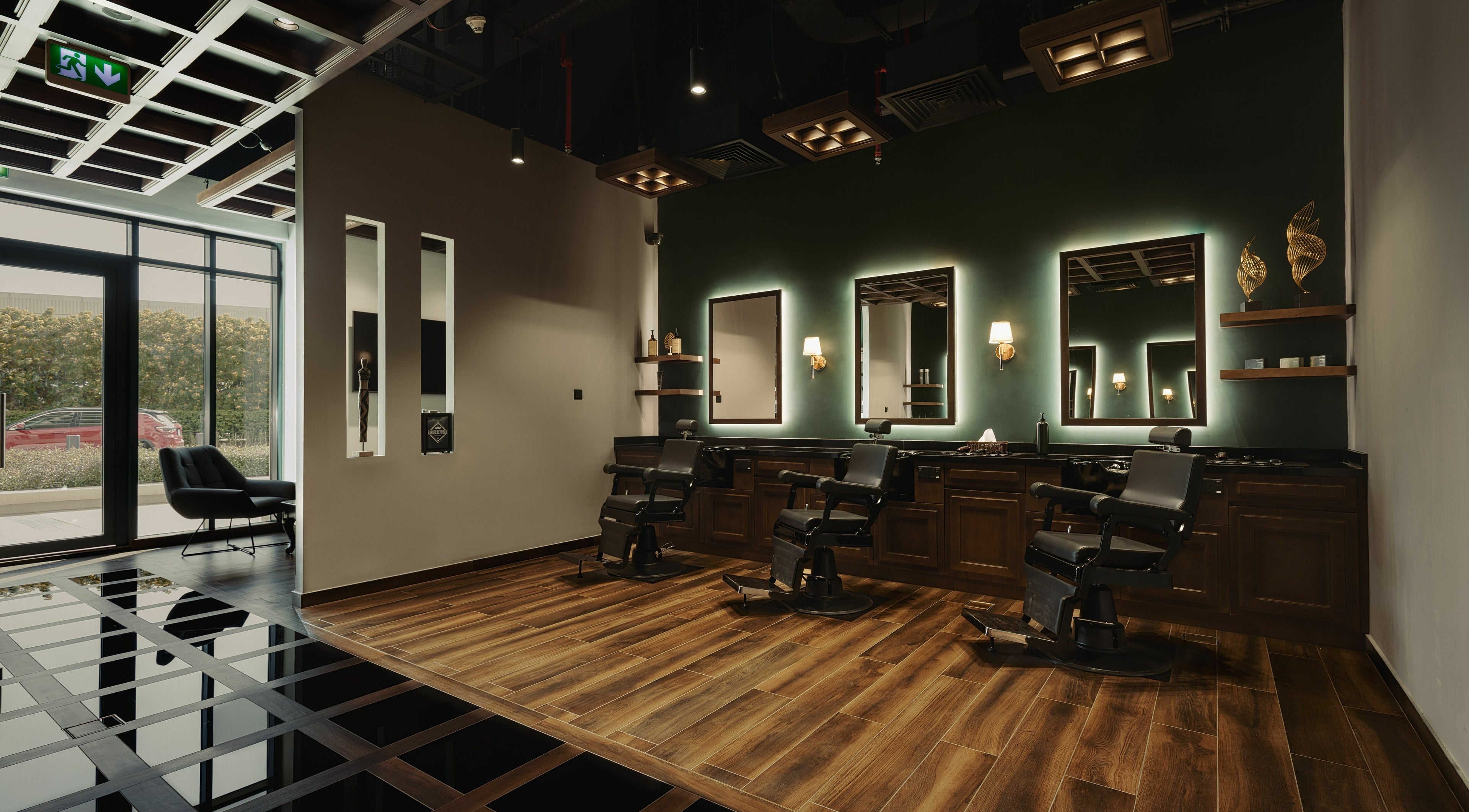 Stylish interior of Barber Republic Gents Saloon in Dubai, AE with modern chairs and lighting.