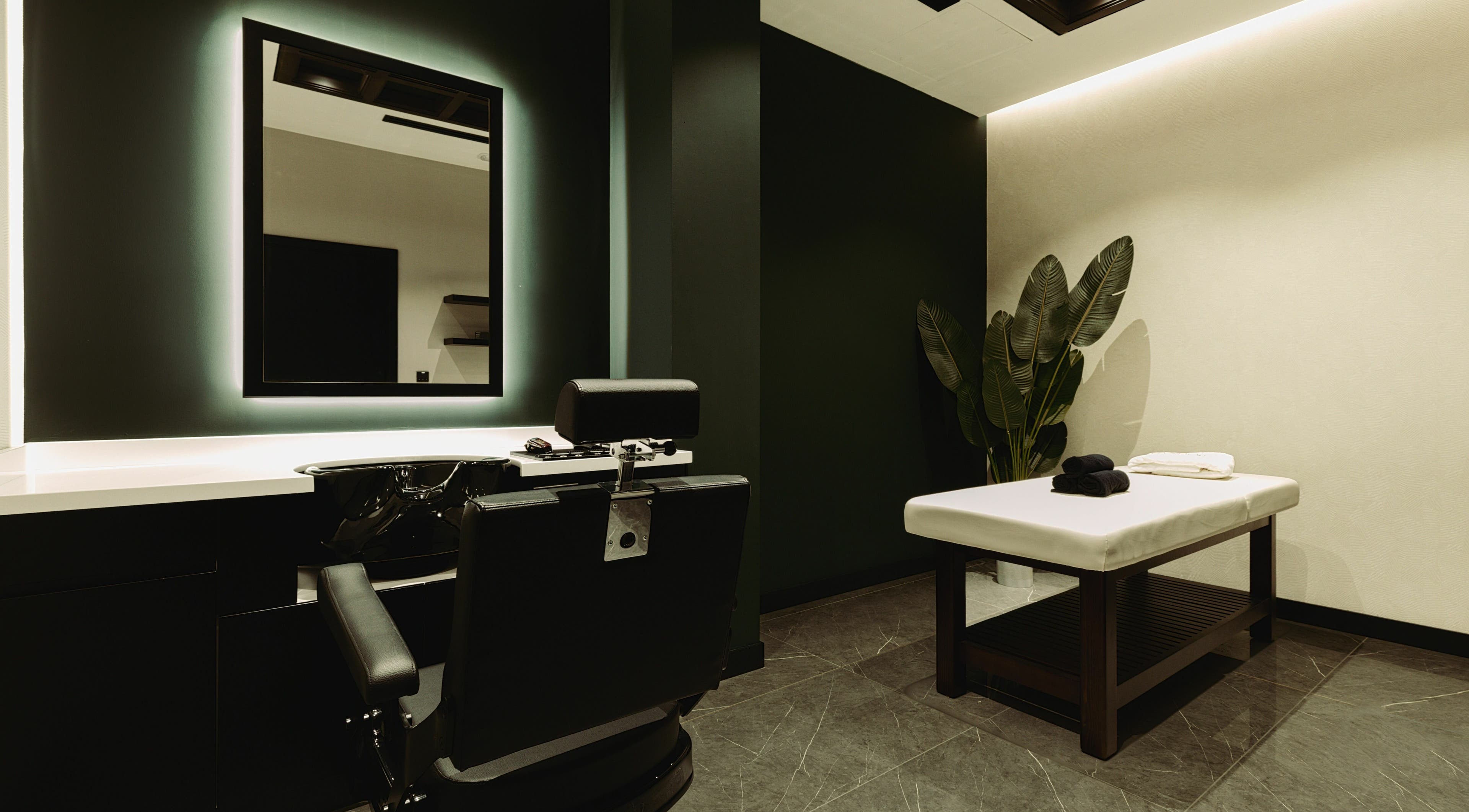 Modern barber chair and relaxing space at Barber Republic Gents Saloon, Dubai, AE.