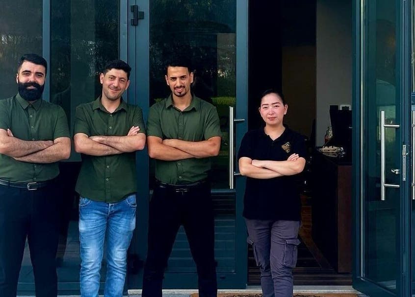 Team at Barber Republic Gents Saloon in Dubai, AE standing confidently outside the venue.