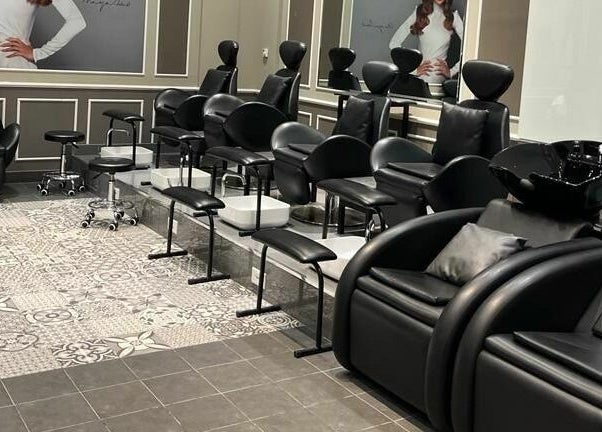 Elegant salon seating arrangement at Lushways Salon - Barsha, Dubai, Dubai, AE, featuring sleek black chairs.