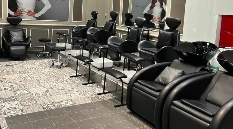 Elegant salon seating arrangement at Lushways Salon - Barsha, Dubai, Dubai, AE, featuring sleek black chairs.