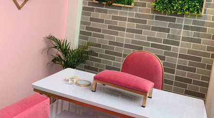 Stylish pink manicure station at Kath Nail Lounge, Guagua, Central Luzon, PH, with plants and decor.