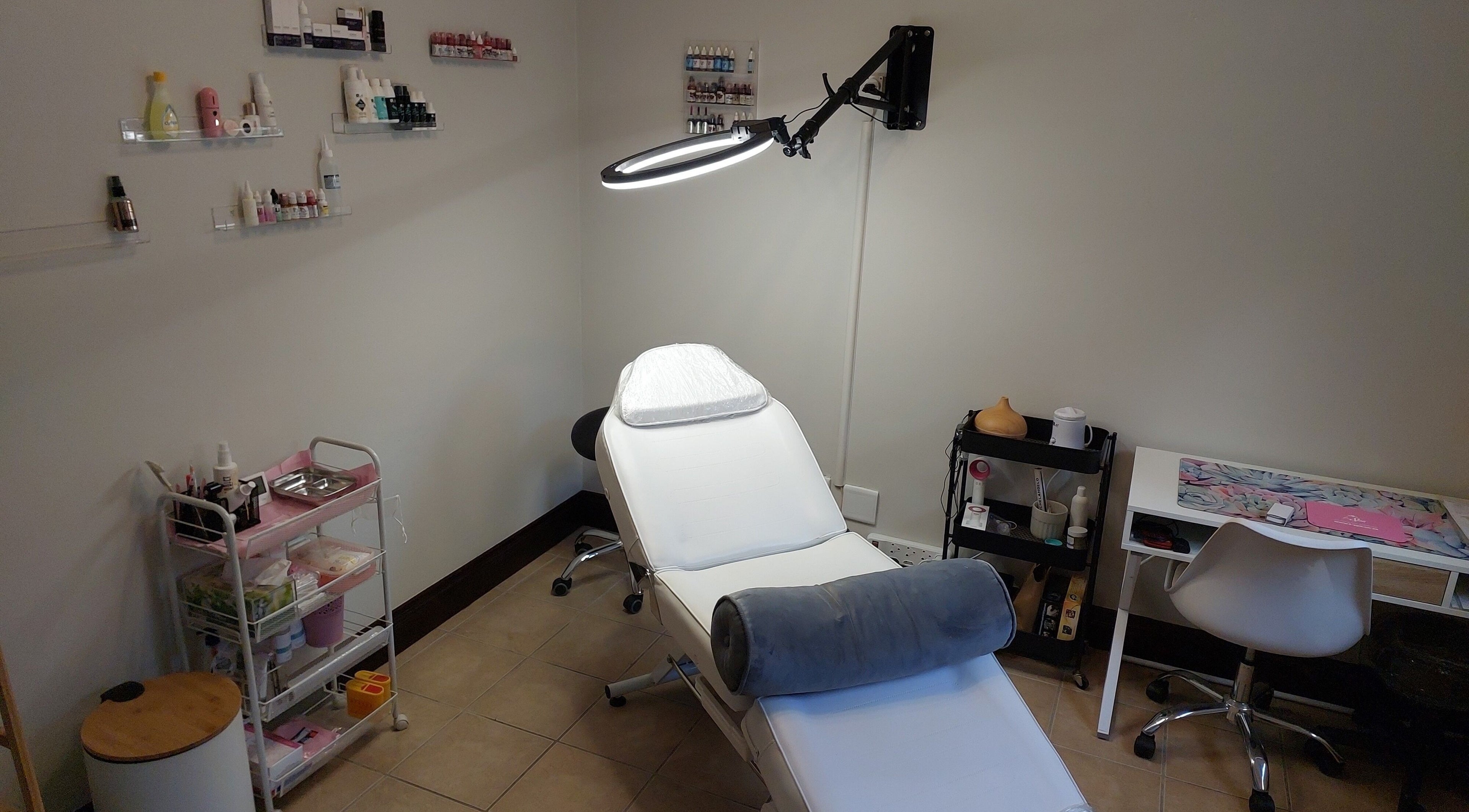 Elegant treatment room at Captivate Aesthetic Artistry in Sandton, Gauteng, ZA, featuring a modern setup.