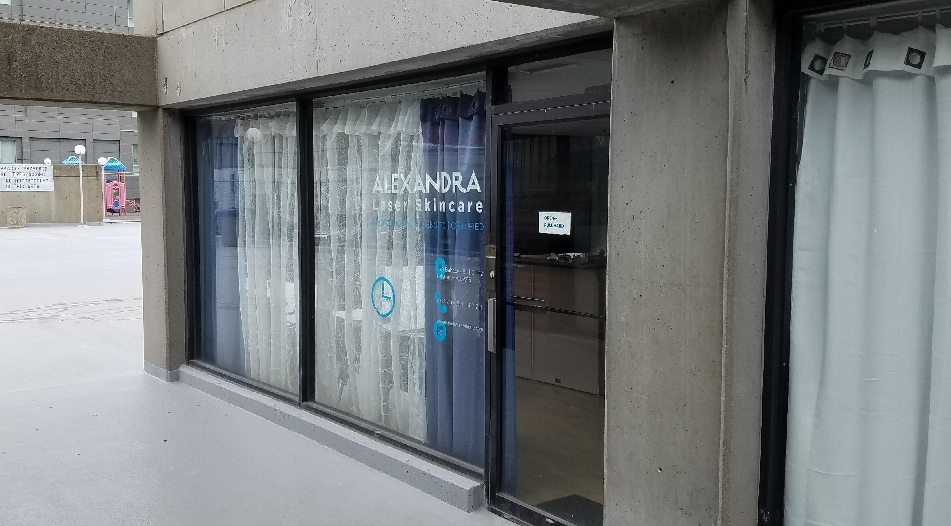 Exterior of Alexandra Laser Skincare in Boston, Massachusetts, US, featuring sleek window design and signage.