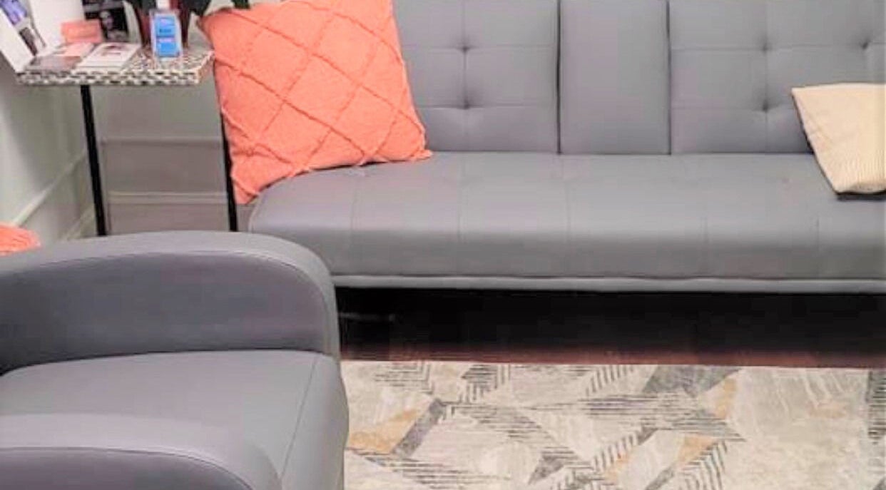 Comfortable seating area at Alexandra Laser Skincare - Newton, Newton, Massachusetts, US with modern decor.