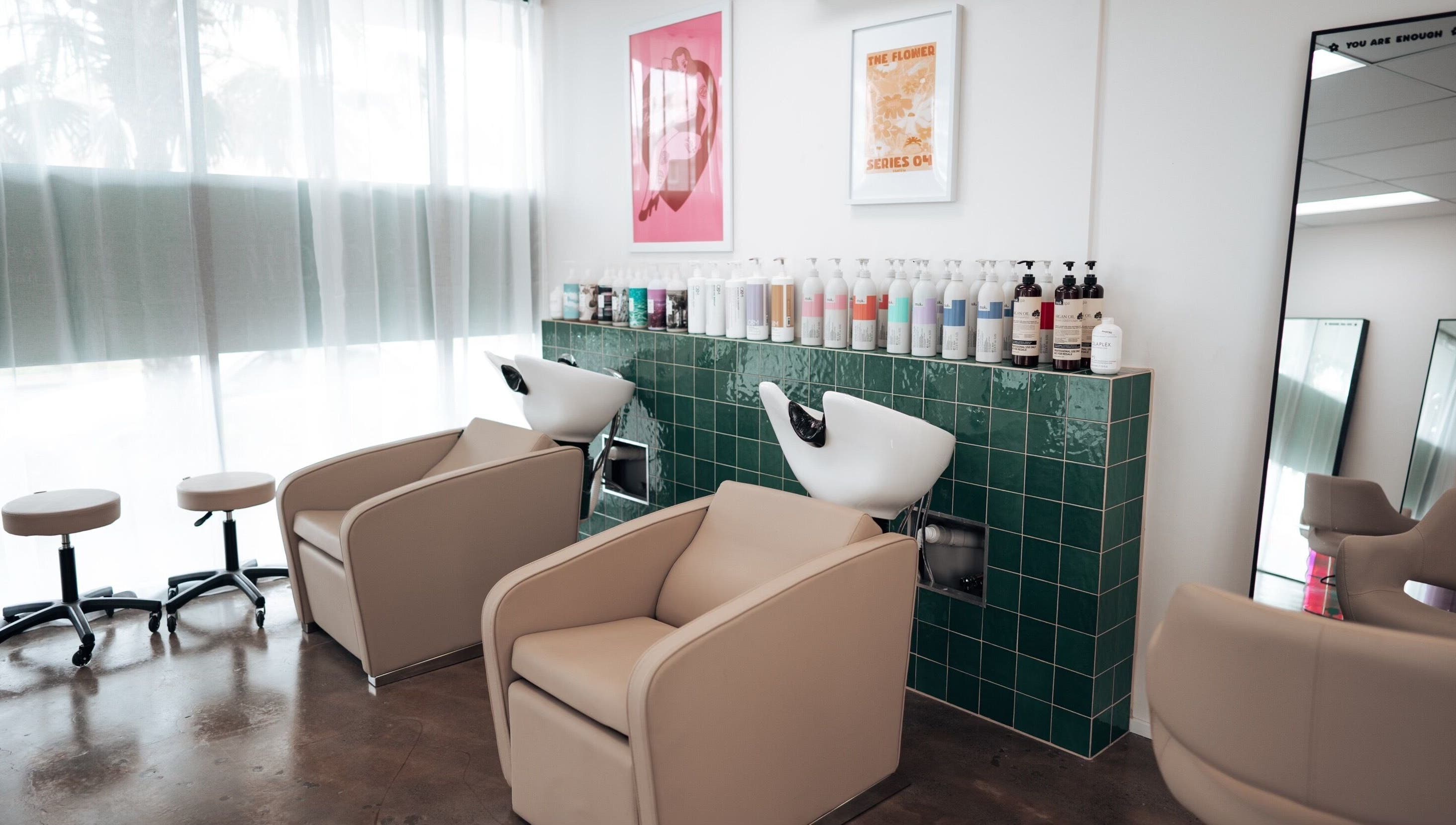 Sophisticated salon chairs and wash basins at Hunny Mane Hair Artistry, Maroochydore, Queensland, AU.