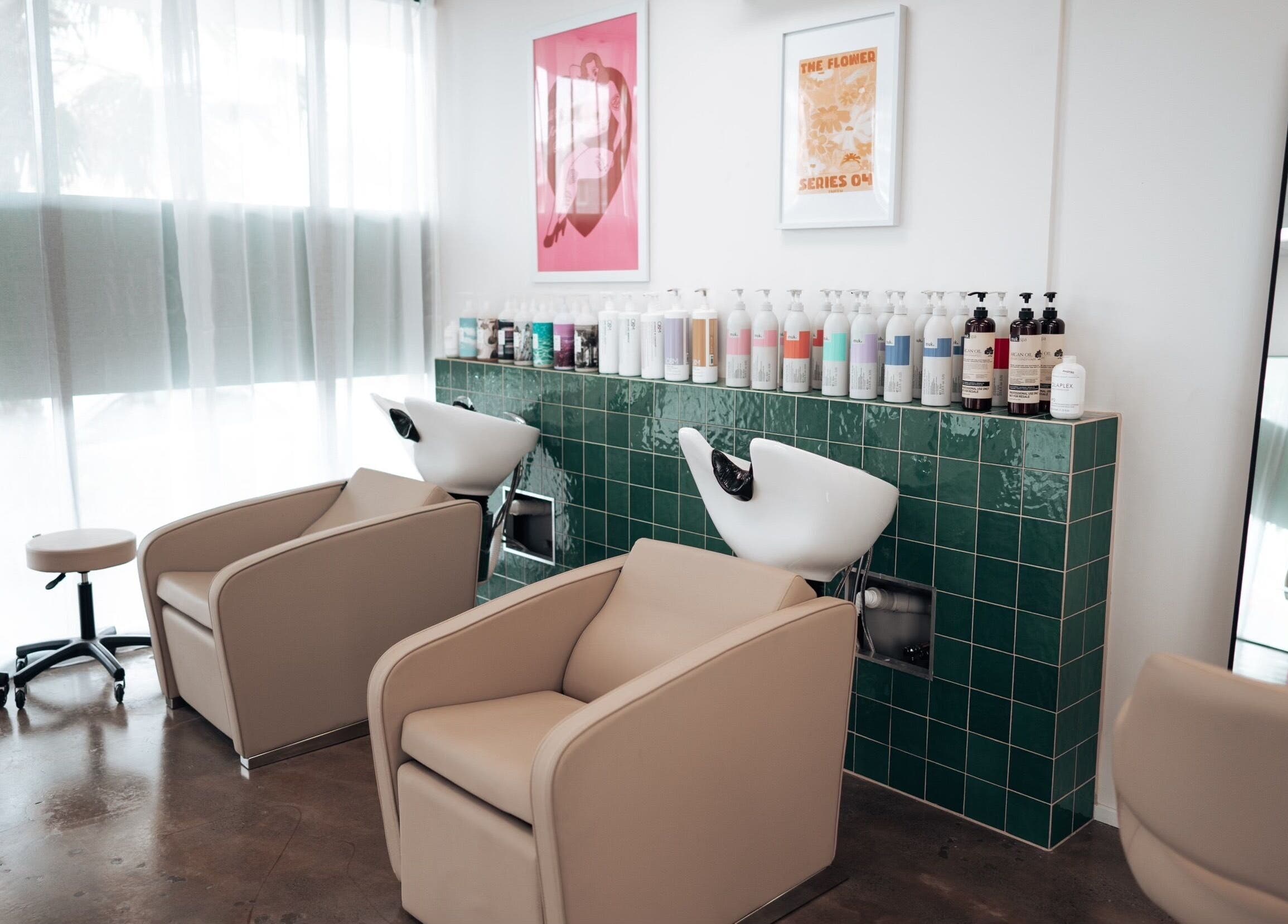 Sophisticated salon chairs and wash basins at Hunny Mane Hair Artistry, Maroochydore, Queensland, AU.
