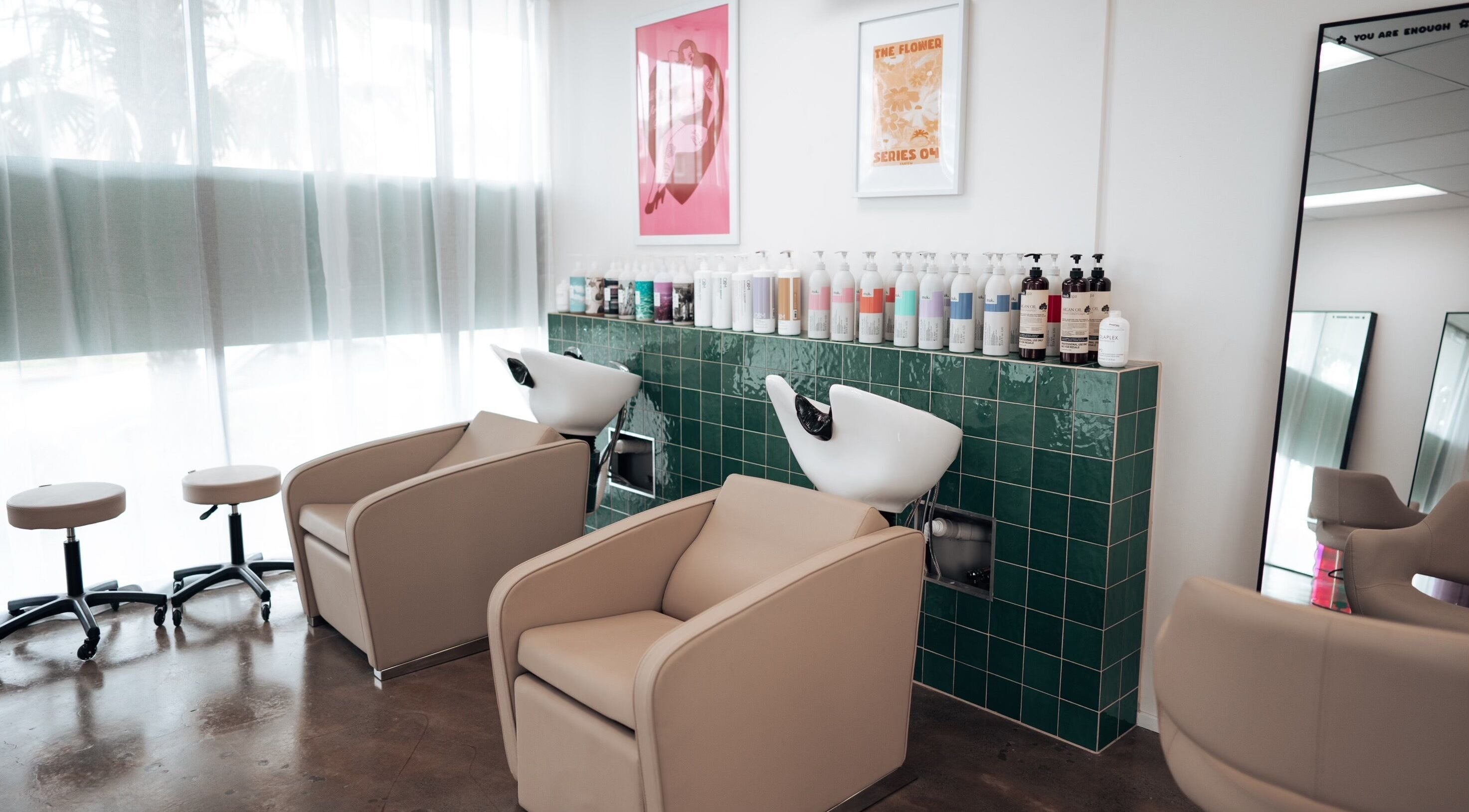 Modern wash station at Hunny Mane Hair Artistry, Maroochydore, Queensland, AU. Stylish chairs and green tiles.