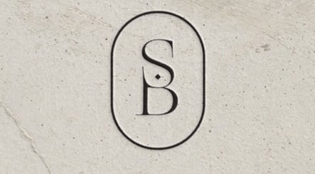 Siren Beauty Warrnambool logo in Warrnambool, Victoria, AU: elegant SB monogram on textured background.