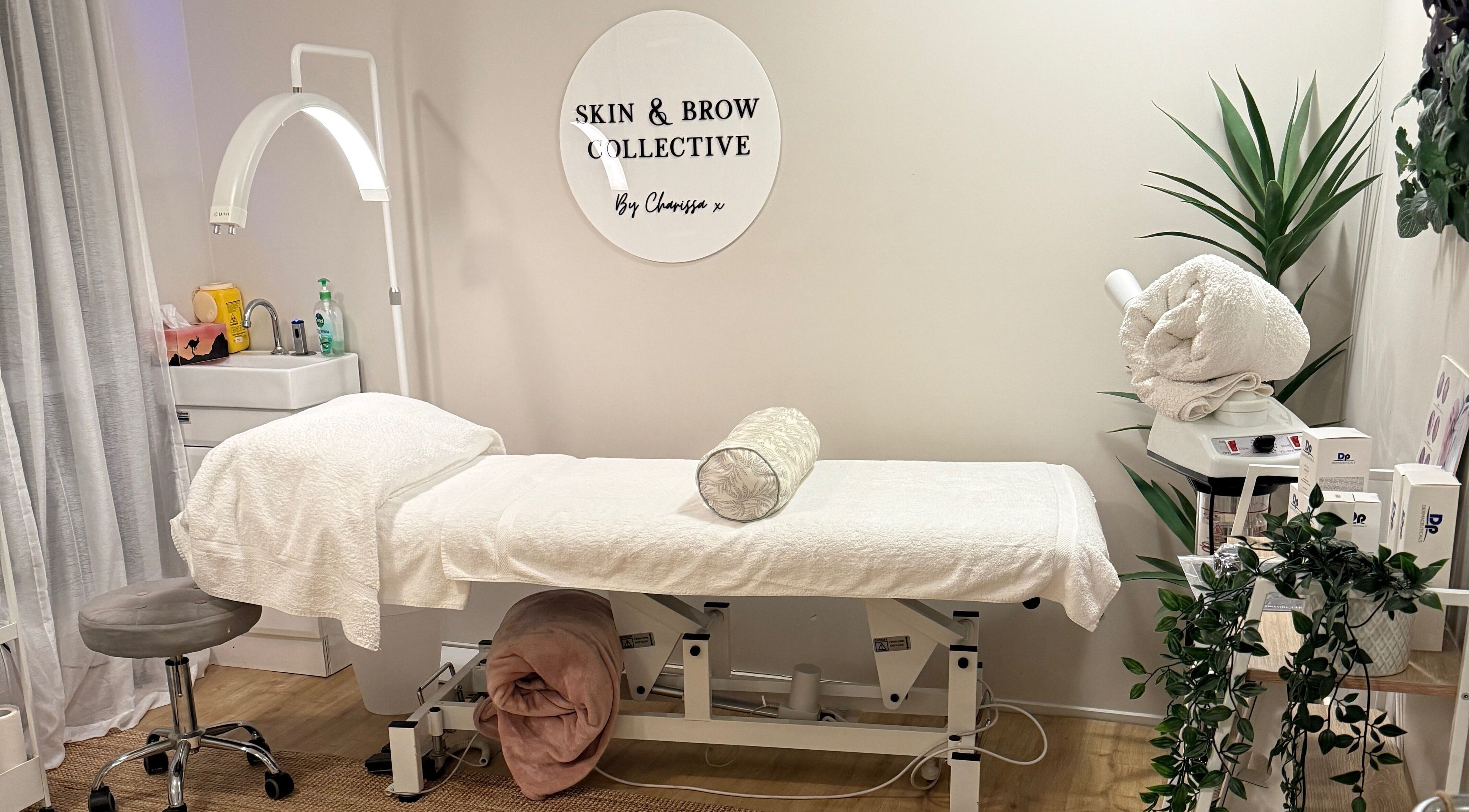 Tranquil treatment room at Skin & Brow Collective in Peregian Springs, Queensland, AU with neatly arranged decor.