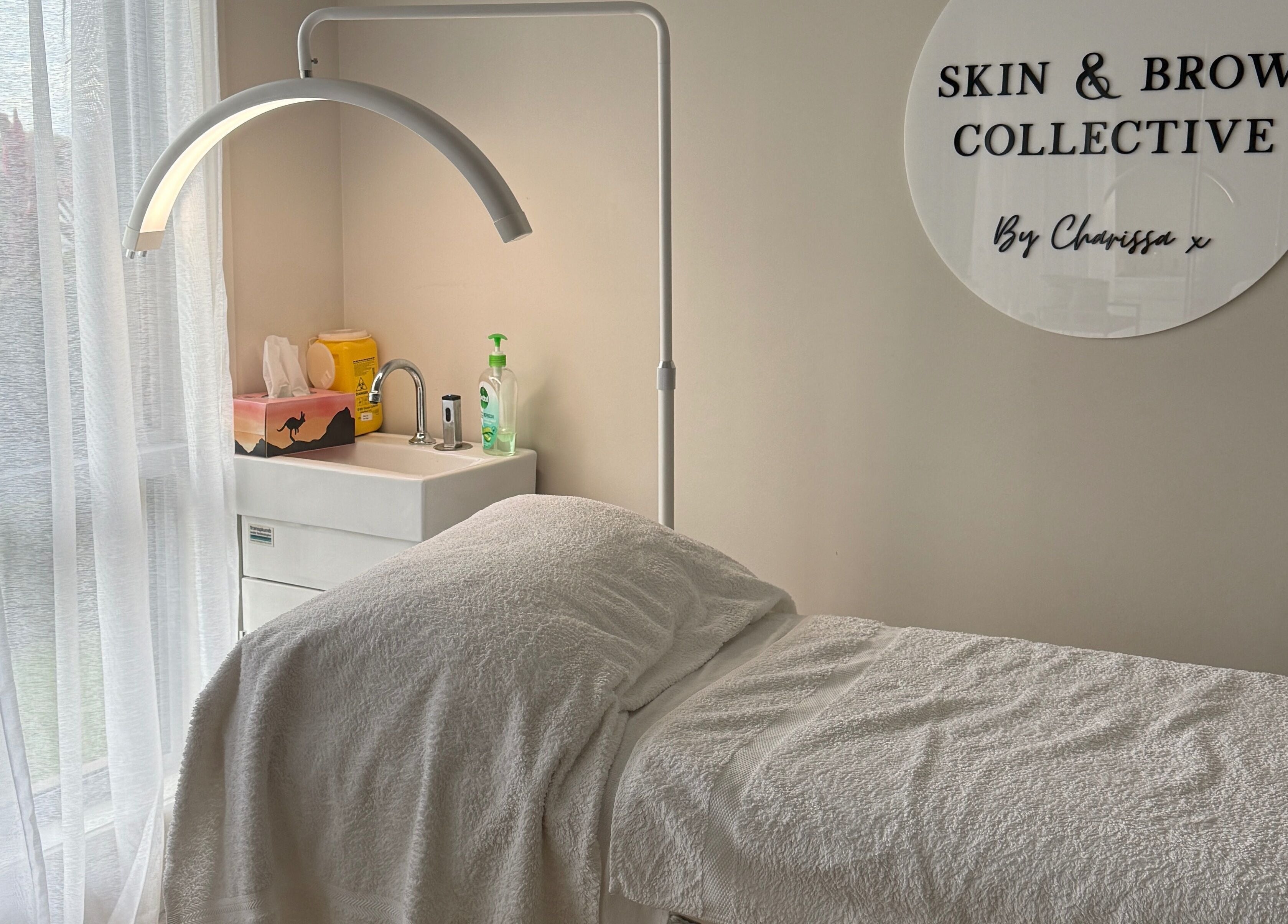 Tranquil treatment room at Skin & Brow Collective, Peregian Springs, Queensland, AU, with a comfortable massage table.