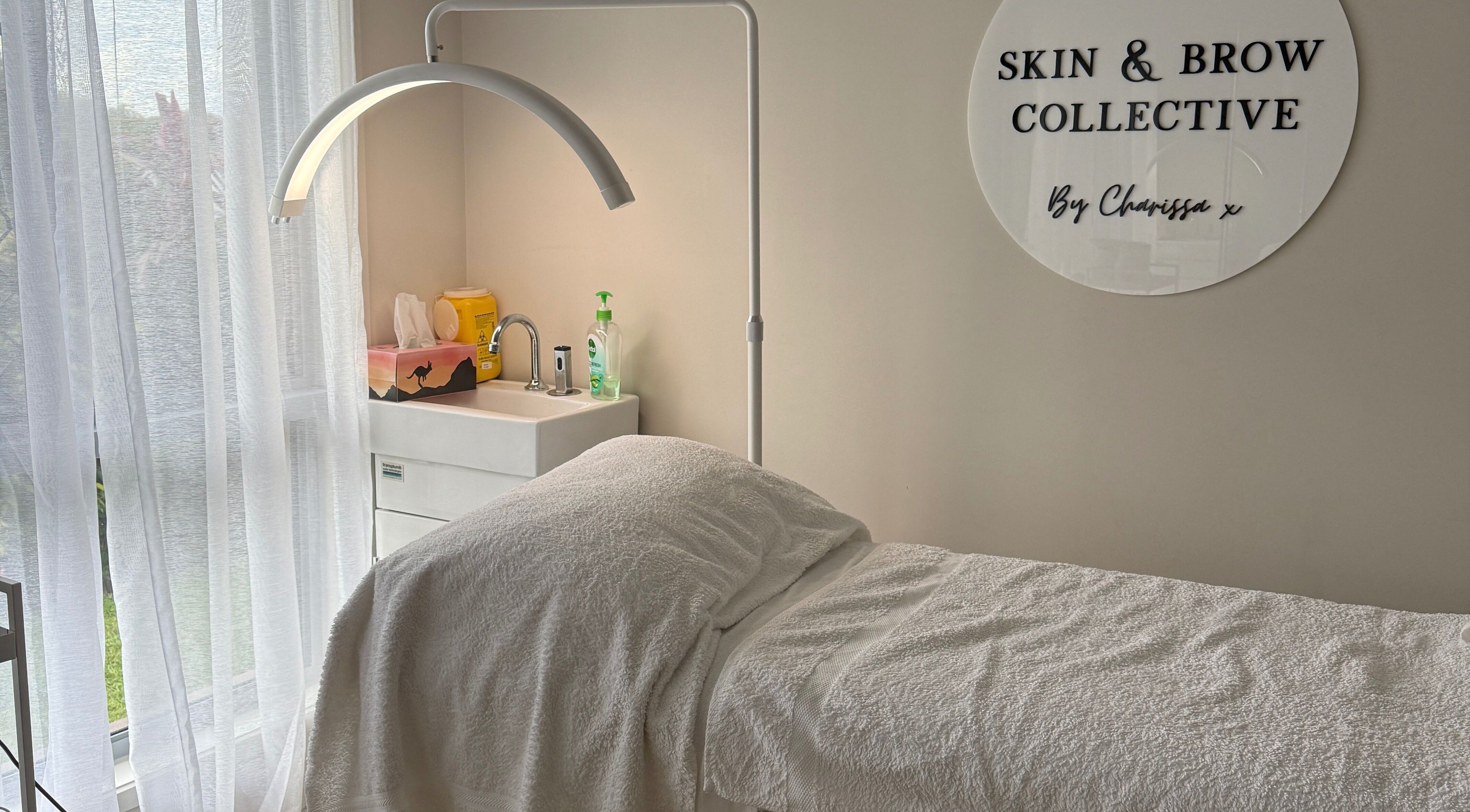 Tranquil treatment room at Skin & Brow Collective, Peregian Springs, Queensland, AU, with a comfortable massage table.