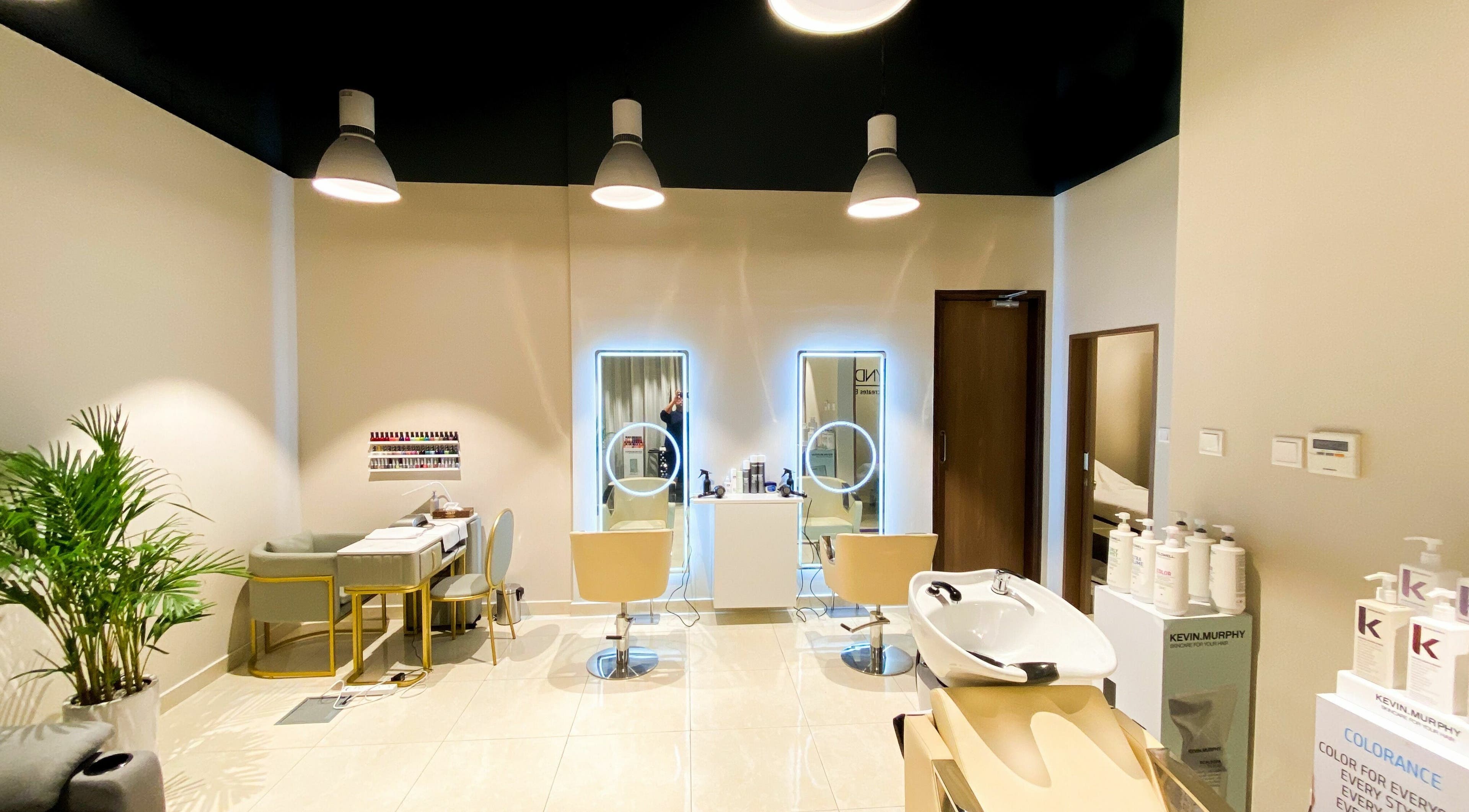 Chic salon setup at South Beauty Centre, دبي, دبي, AE with stylish chairs and illuminated mirrors.