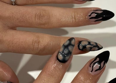 Intricate black nail design at Gelled by NR, Melbourne, Victoria, AU, showcasing modern elegance.