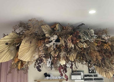 Elegant dried floral arrangement on ceiling at Gelled by NR, Melbourne, Victoria, AU.