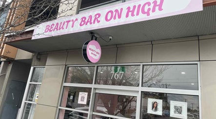 Exterior of Beauty Bar showing vibrant pink signage at 767 Gelled by NR, Melbourne, Victoria, AU.