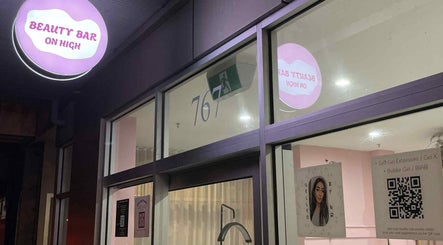 Gelled by NR entrance at night in Melbourne, Victoria, AU showcasing a bright exterior sign.