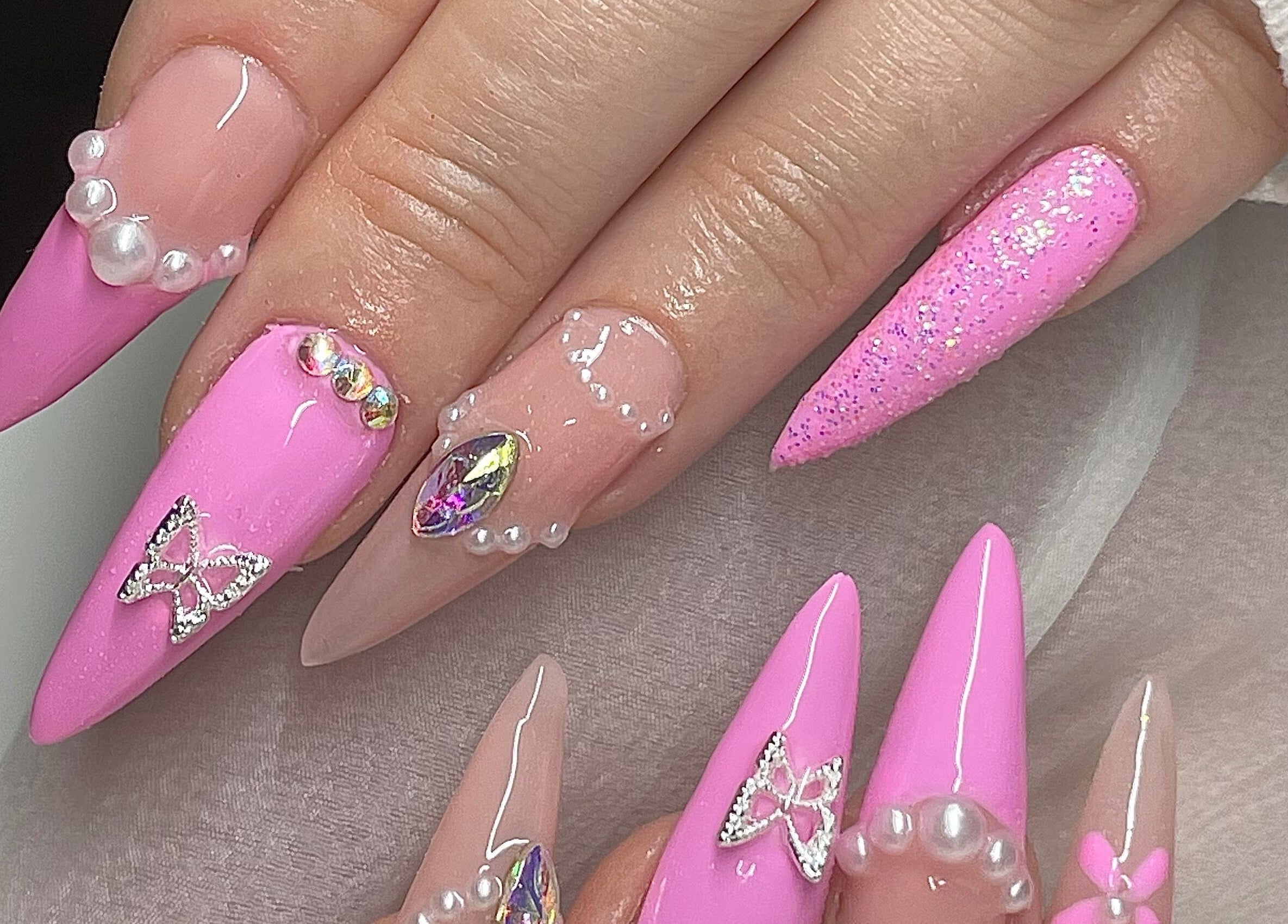 Stunning pink and gem-accented nails from Gelled by NR in Melbourne, Victoria, AU.