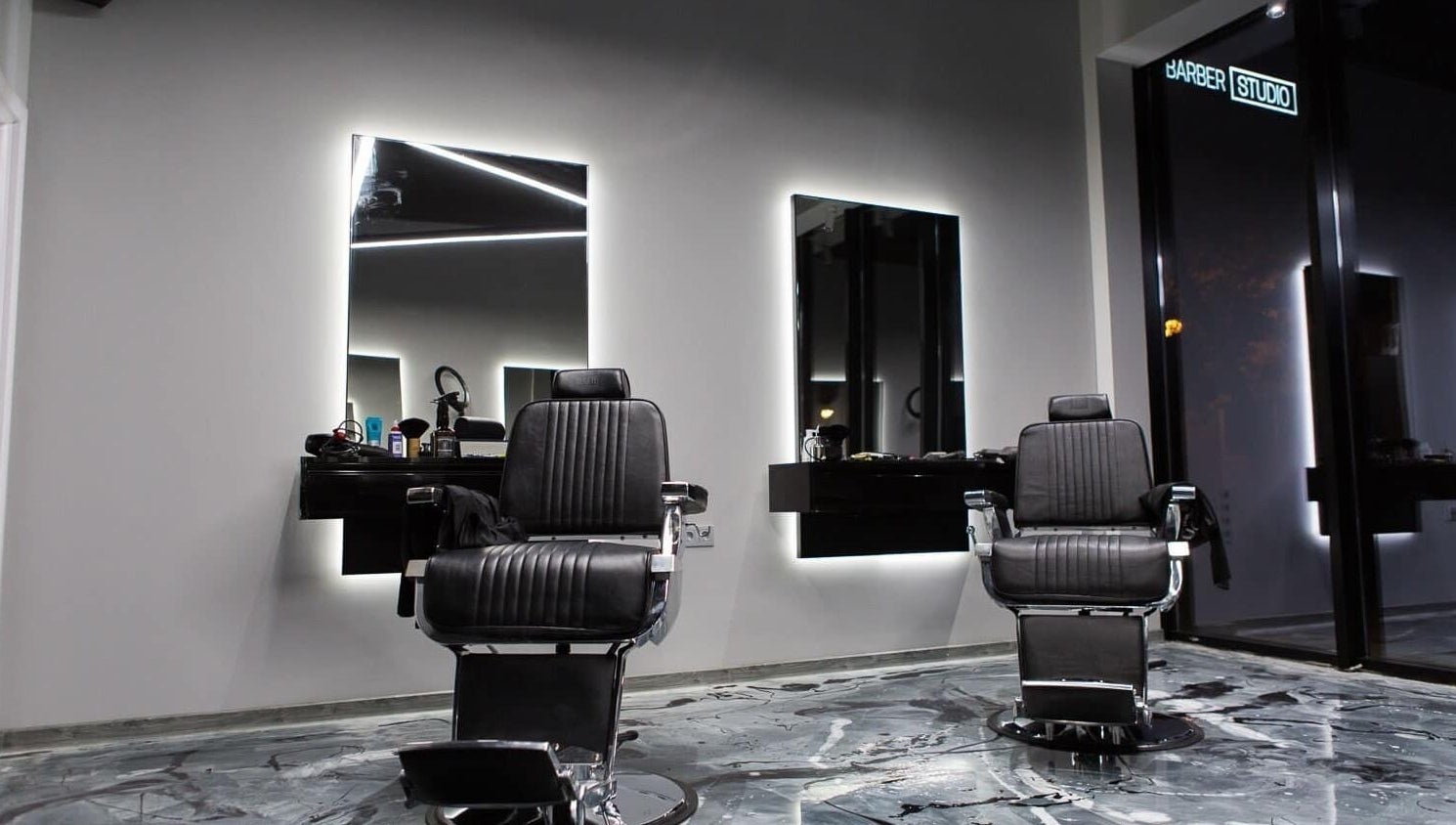 Modern barber chairs at Barber Studio 2, Plovdiv, Plovdiv, BG, showcasing sleek-style interior.