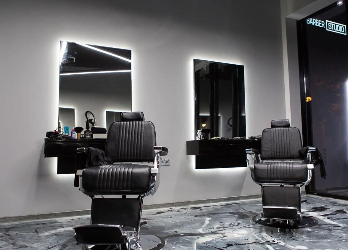 Modern barber chairs at Barber Studio 2, Plovdiv, Plovdiv, BG, showcasing sleek-style interior.