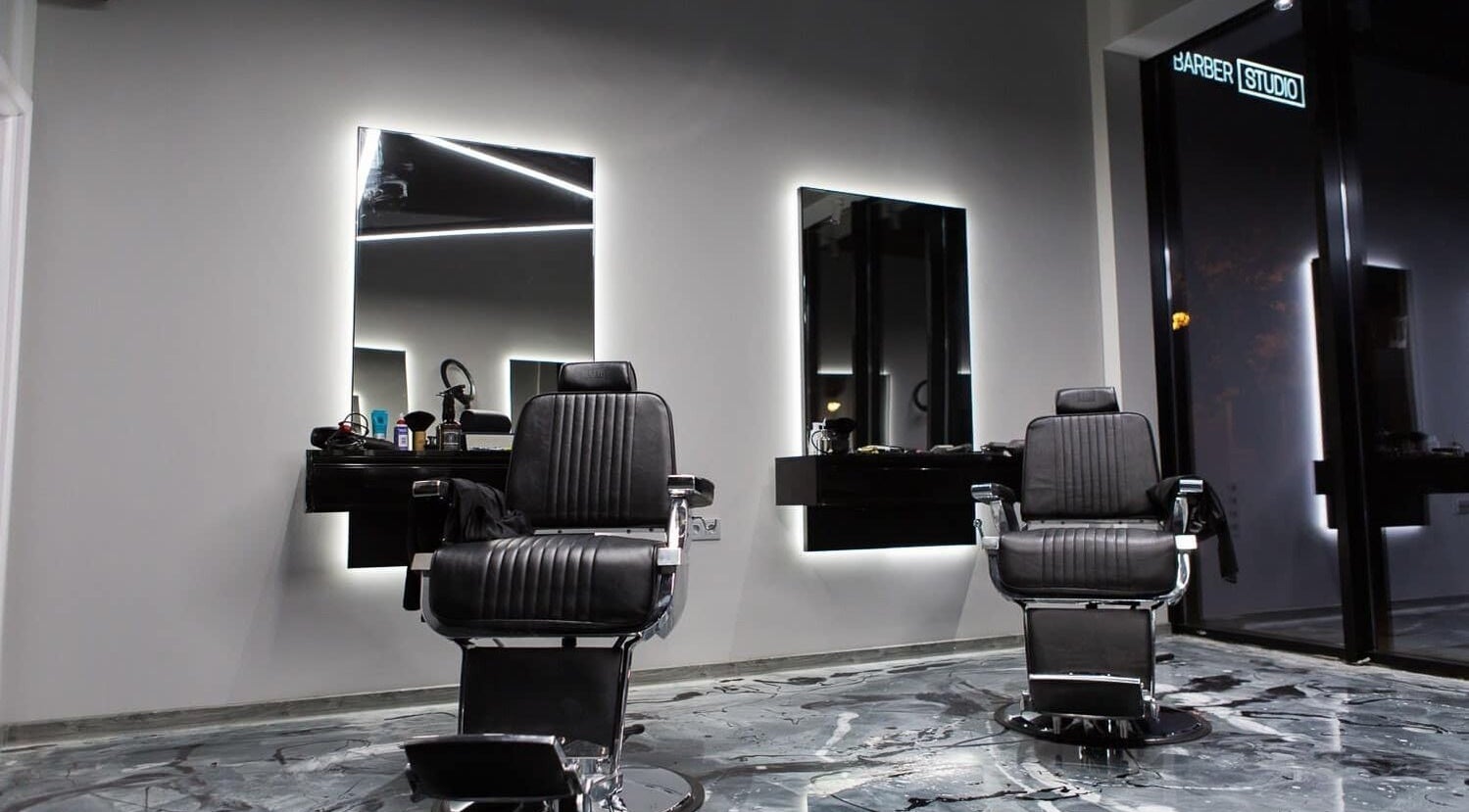 Modern barber chairs at Barber Studio 2, Plovdiv, Plovdiv, BG, showcasing sleek-style interior.