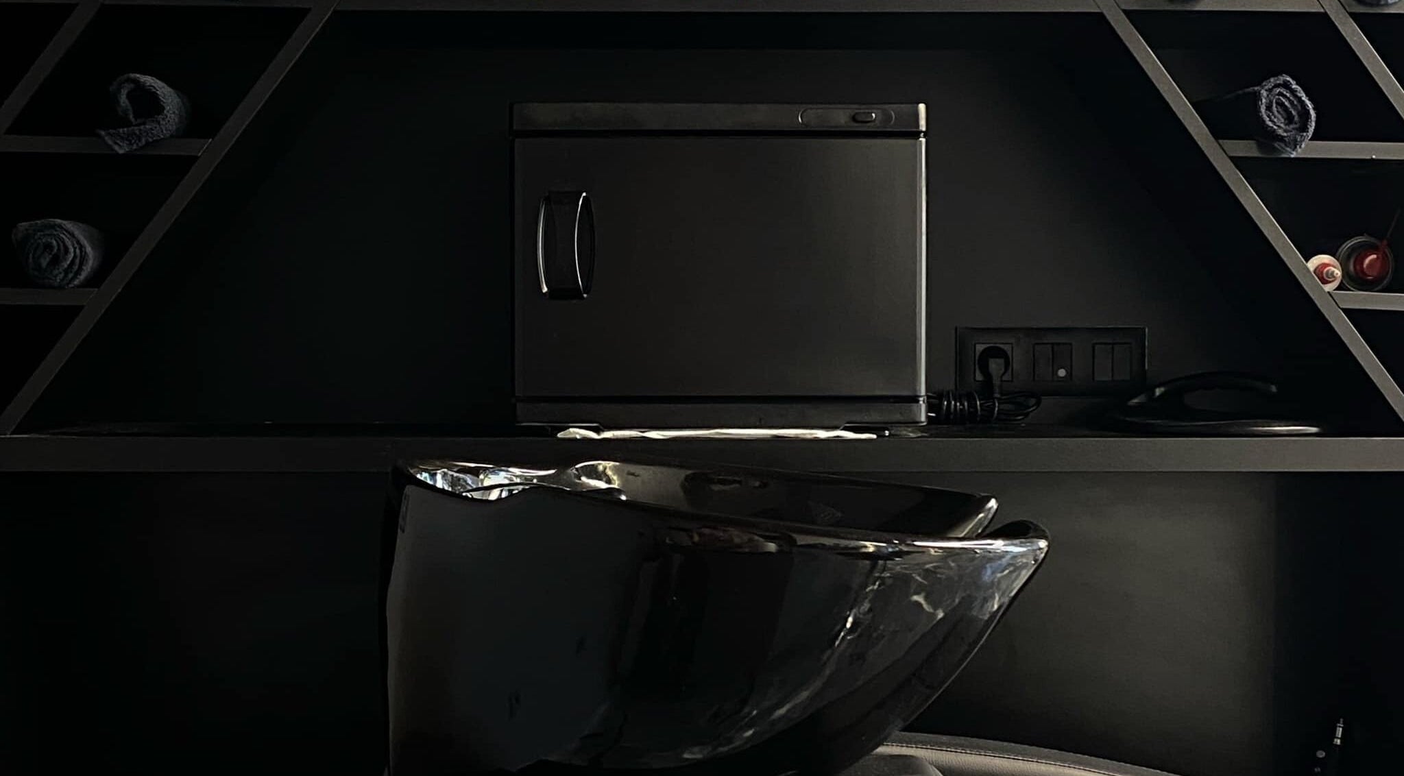 Elegant black styling station at Barber Studio 2 in Plovdiv, Plovdiv, BG, with modern fixtures.