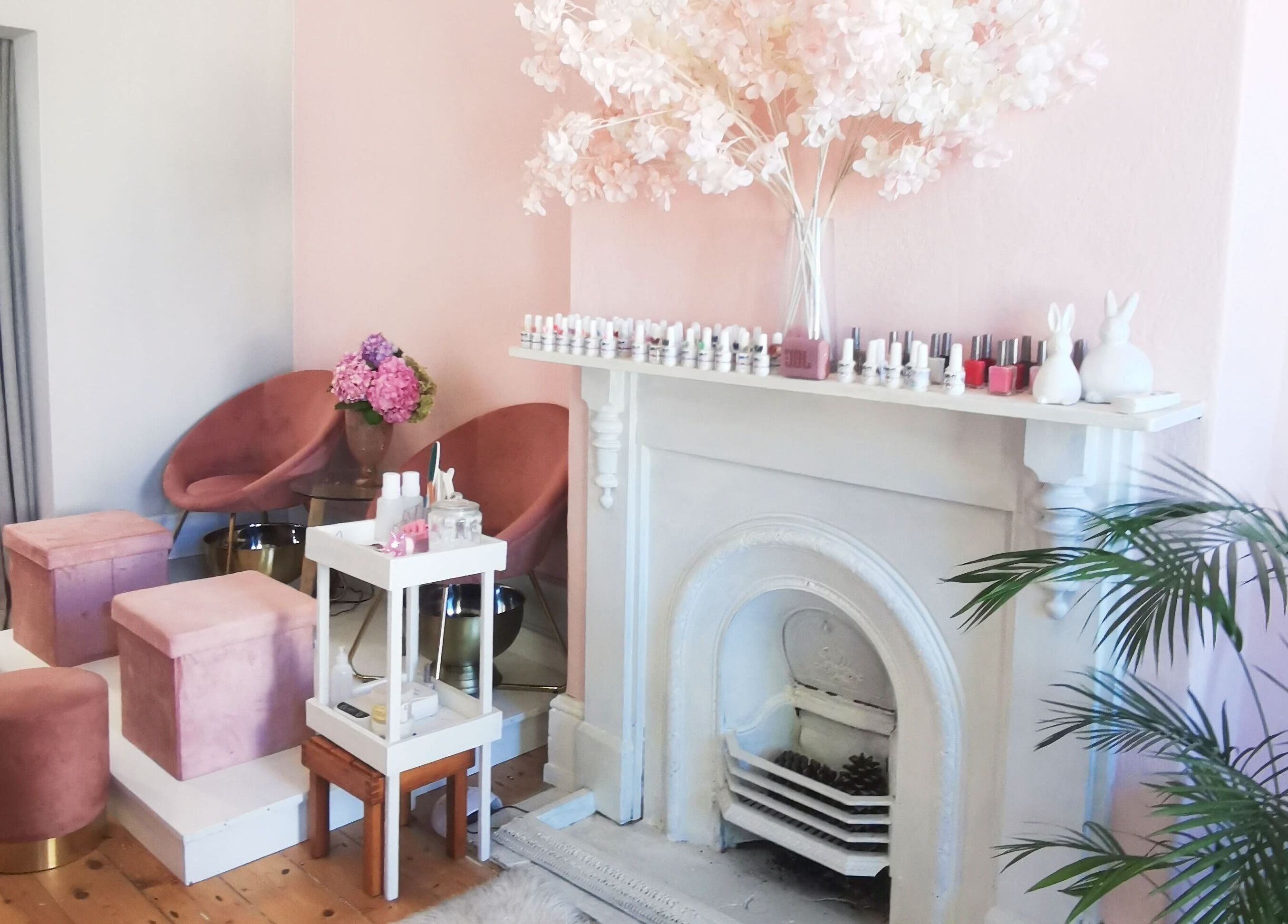 Elegant beauty corner at NovaBelle Beauty, Cape Town, Western Cape, ZA with plush seats and pink hydrangeas.