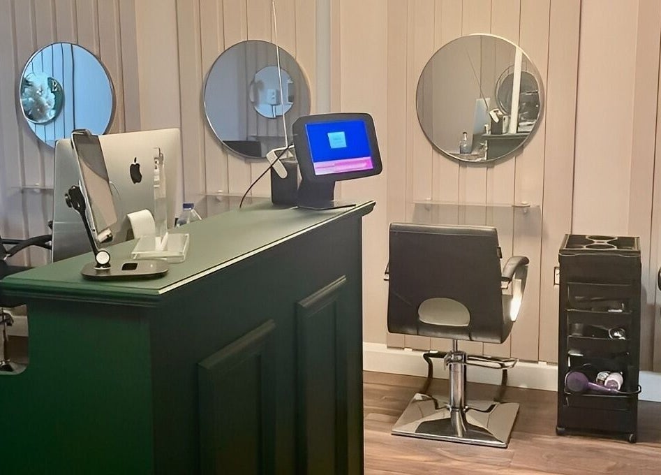 Cherry Bomb salon interior with modern styling stations in Frodsham, England, GB.