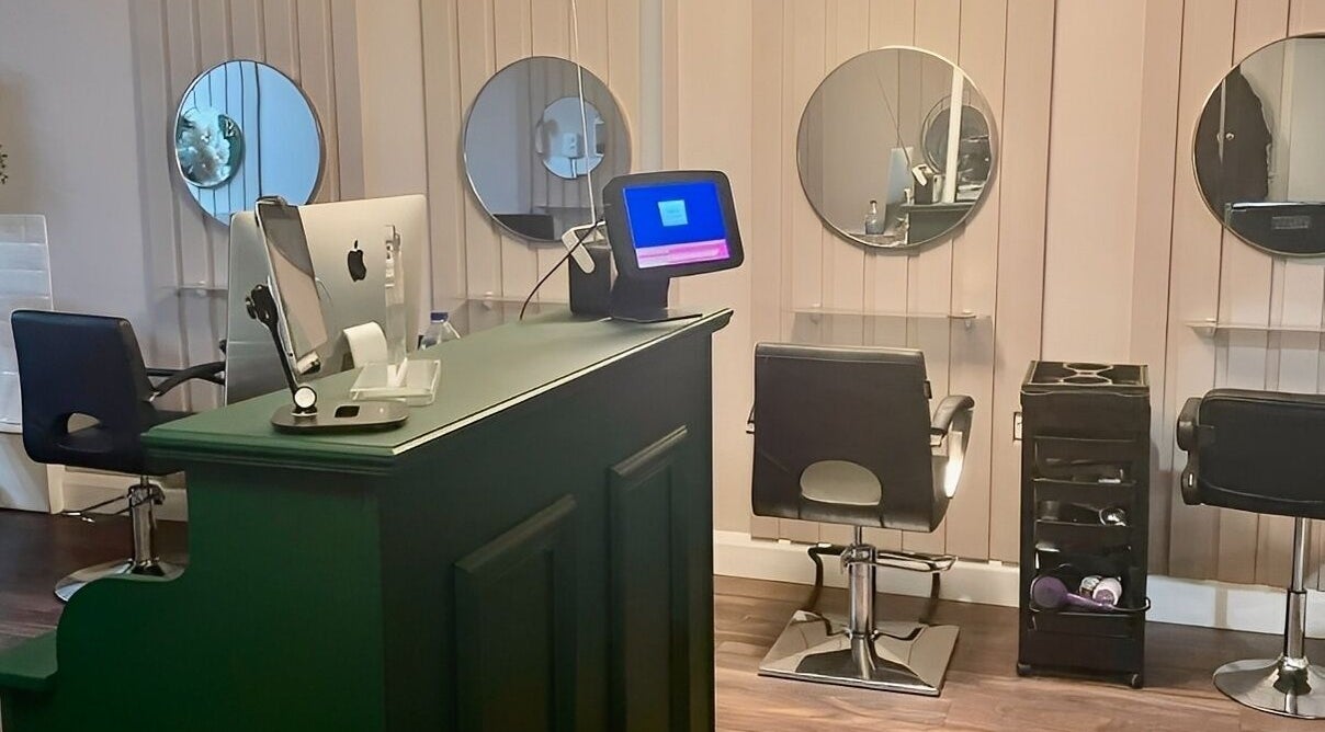 Cherry Bomb salon interior with modern styling stations in Frodsham, England, GB.