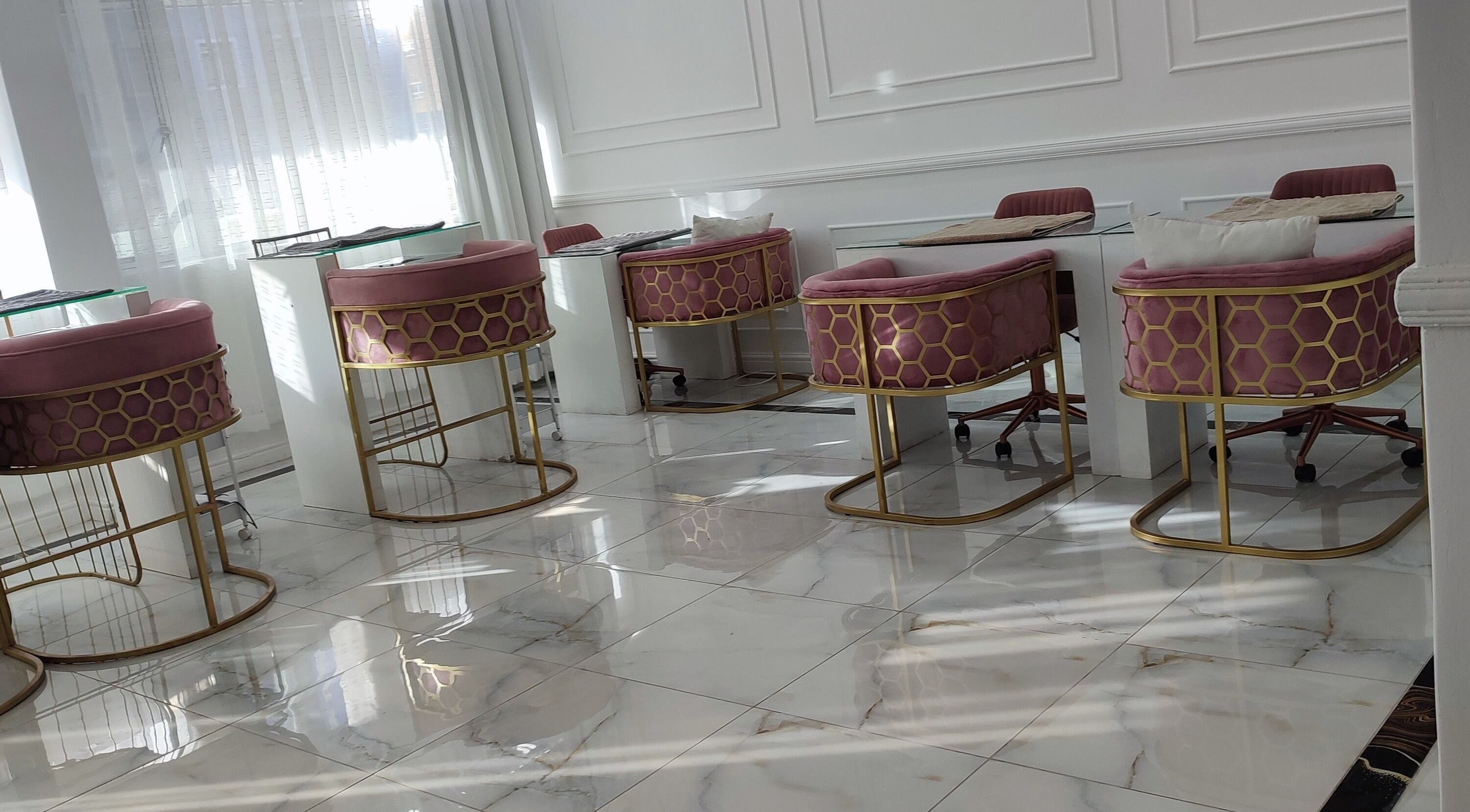 Chic interior of Head 2 Toes Beauty Bar in Cape Town, Western Cape, ZA with plush pink and gold decor.