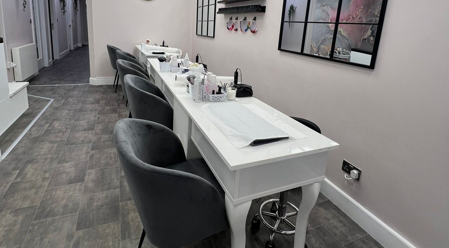 Modern nail service area at Salon 15 Beauty Rooms in Dublin, County Dublin, IE, with sleek decor and seating.