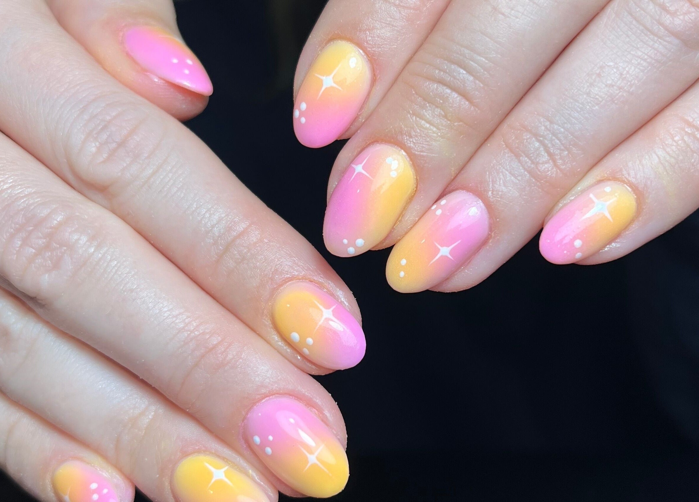 Vibrant pink and yellow ombre nails at The Paint Bar, Brighton And Hove, England, GB, showcasing intricate designs.