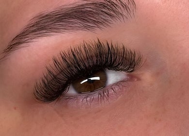 Close-up of expertly applied eyelash extensions at Lashes W Ri in Harrisburg, Illinois, US.