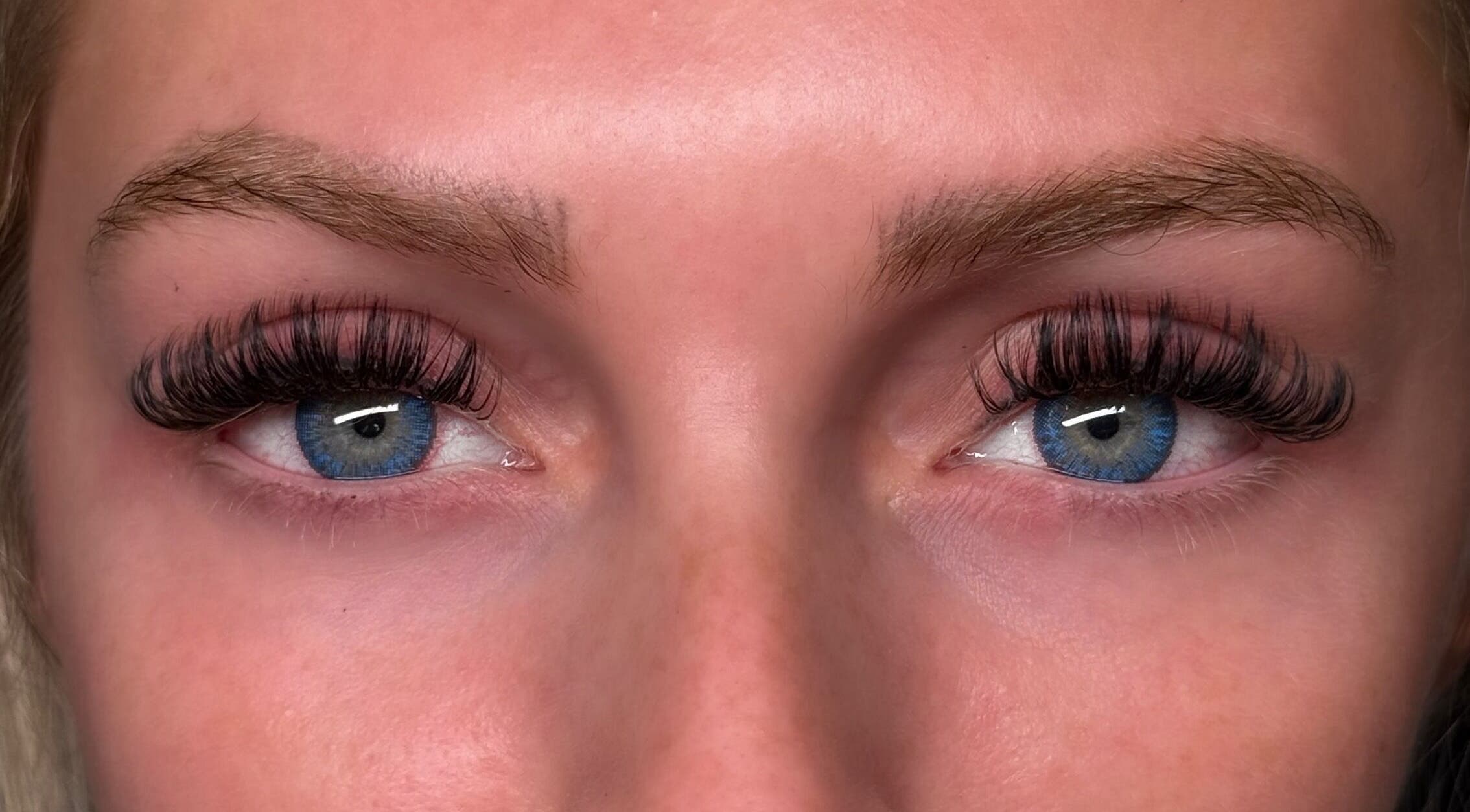 Close-up of eyelash extensions at Lashes W Ri, Harrisburg, Illinois, US, showcasing expert beauty work.