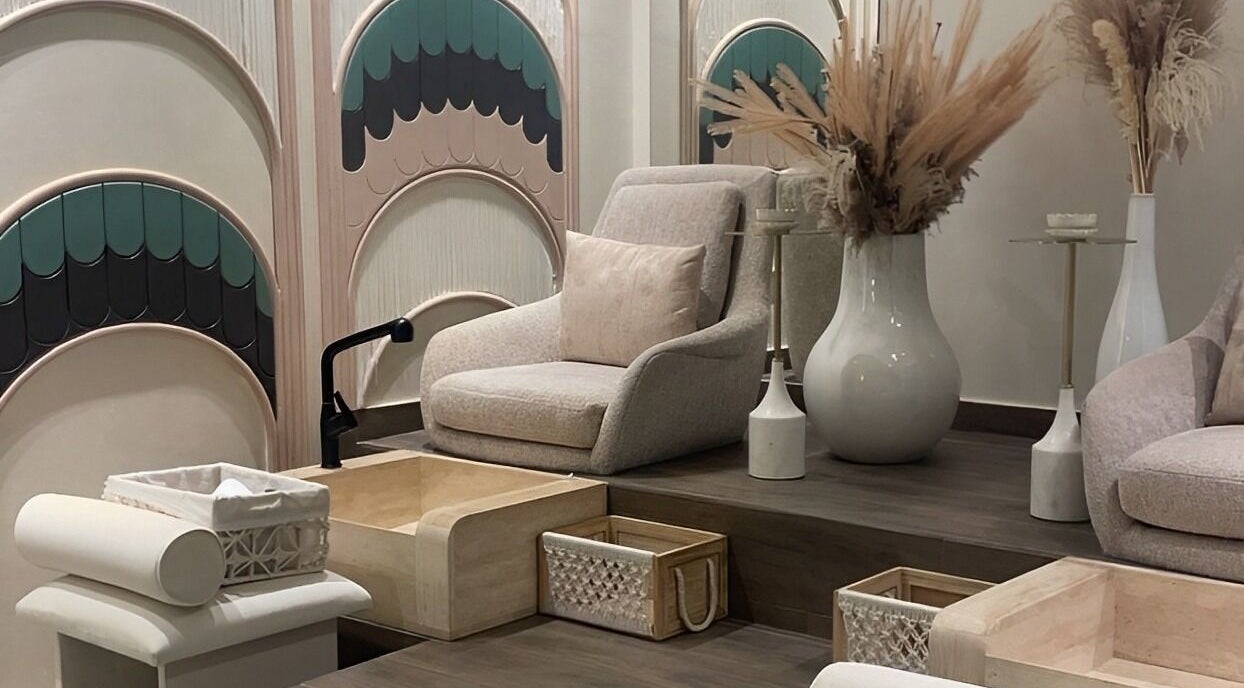 Relaxing pedicure station at Blush Salon, Jeddah, Makkah Province, SA with plush chairs and modern decor.
