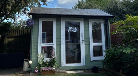 Exterior of Nails by Lilly studio in Wilmslow, England, GB, showcasing a quaint and welcoming garden setting.