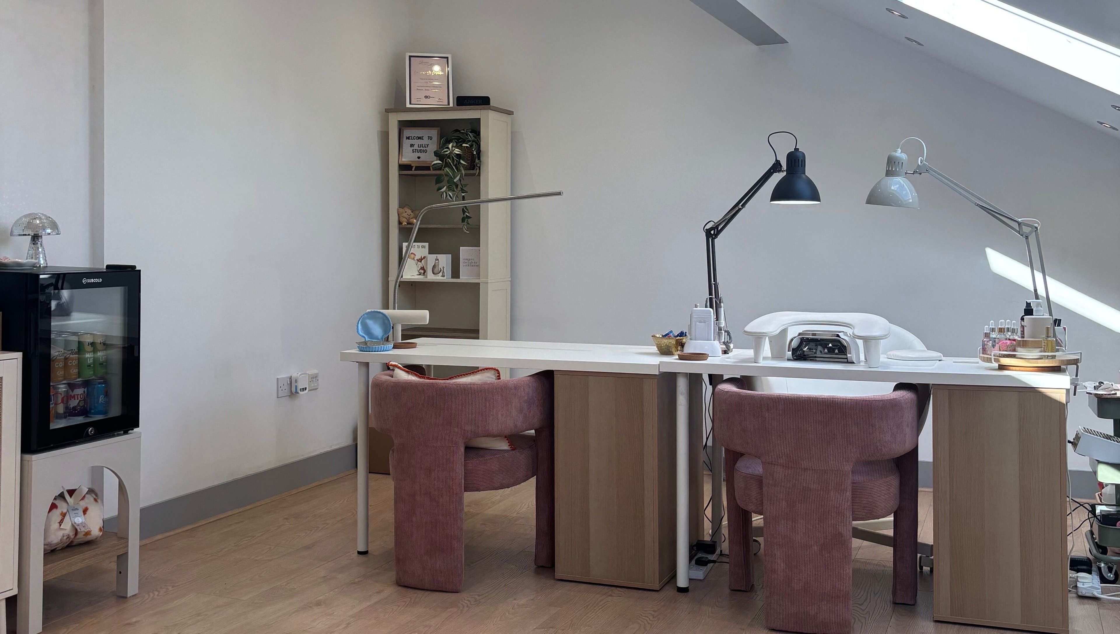 Modern beauty space at By Lilly Studio, Wilmslow, England, GB, featuring plush chairs and stylish decor.