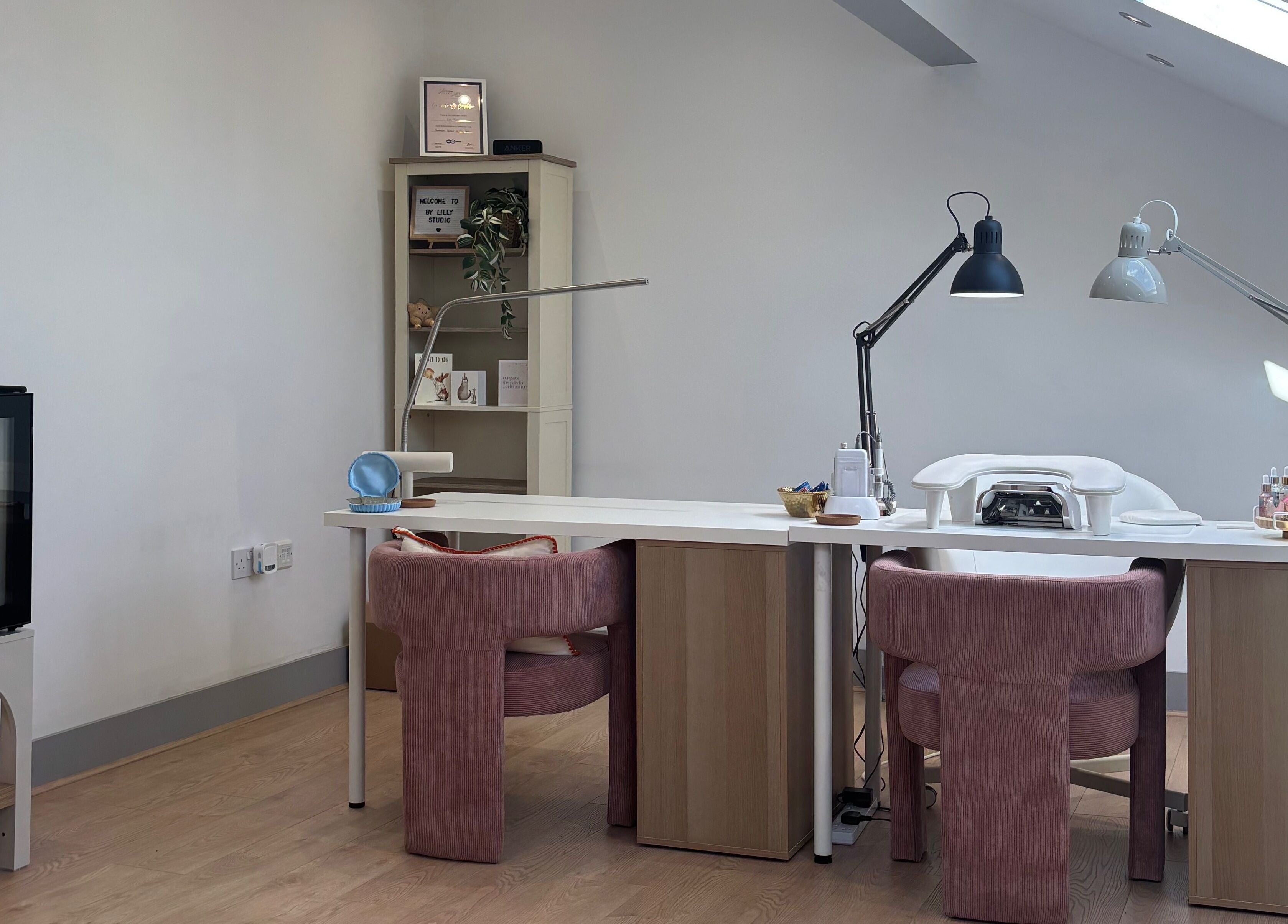 Modern beauty space at By Lilly Studio, Wilmslow, England, GB, featuring plush chairs and stylish decor.