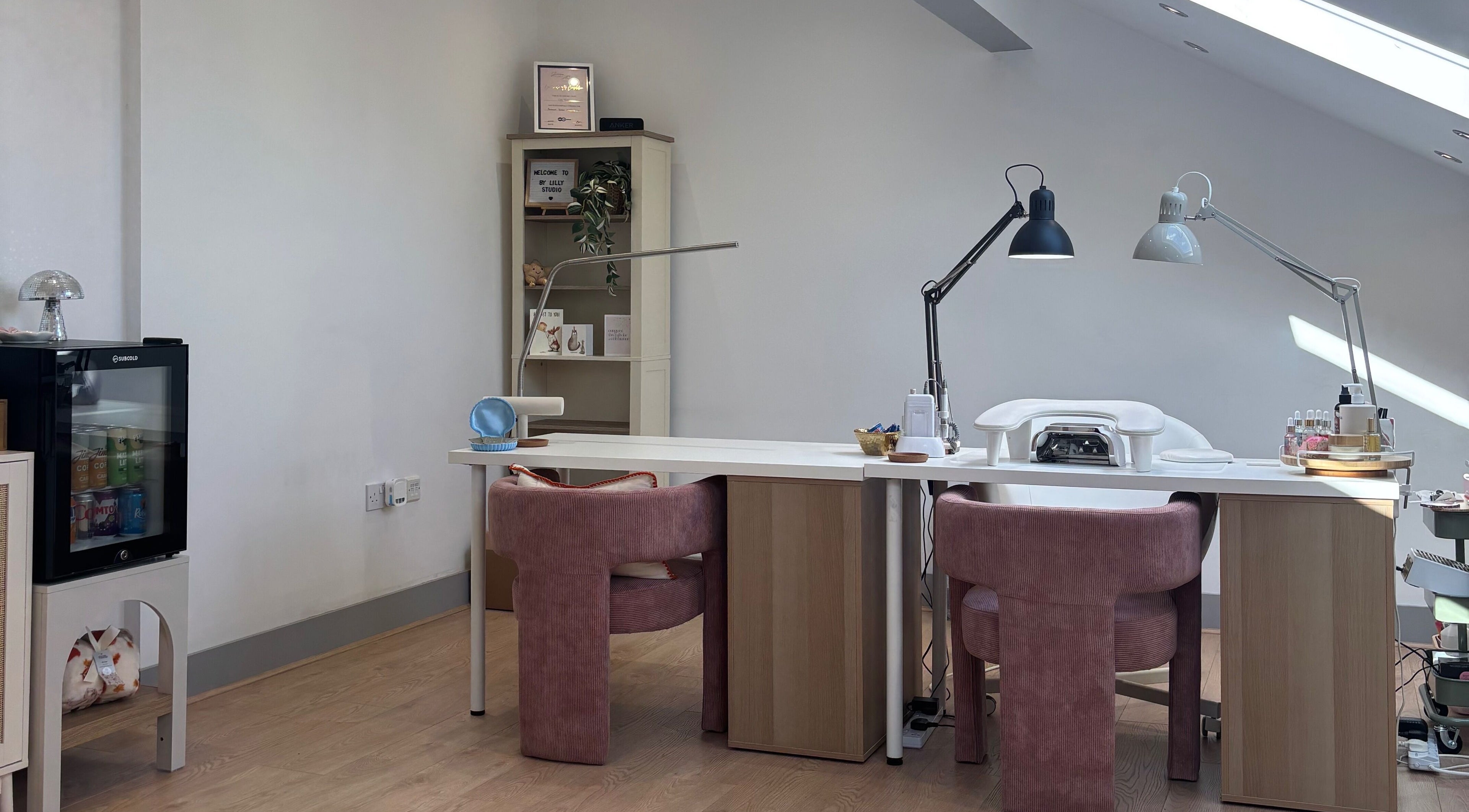 Modern beauty space at By Lilly Studio, Wilmslow, England, GB, featuring plush chairs and stylish decor.