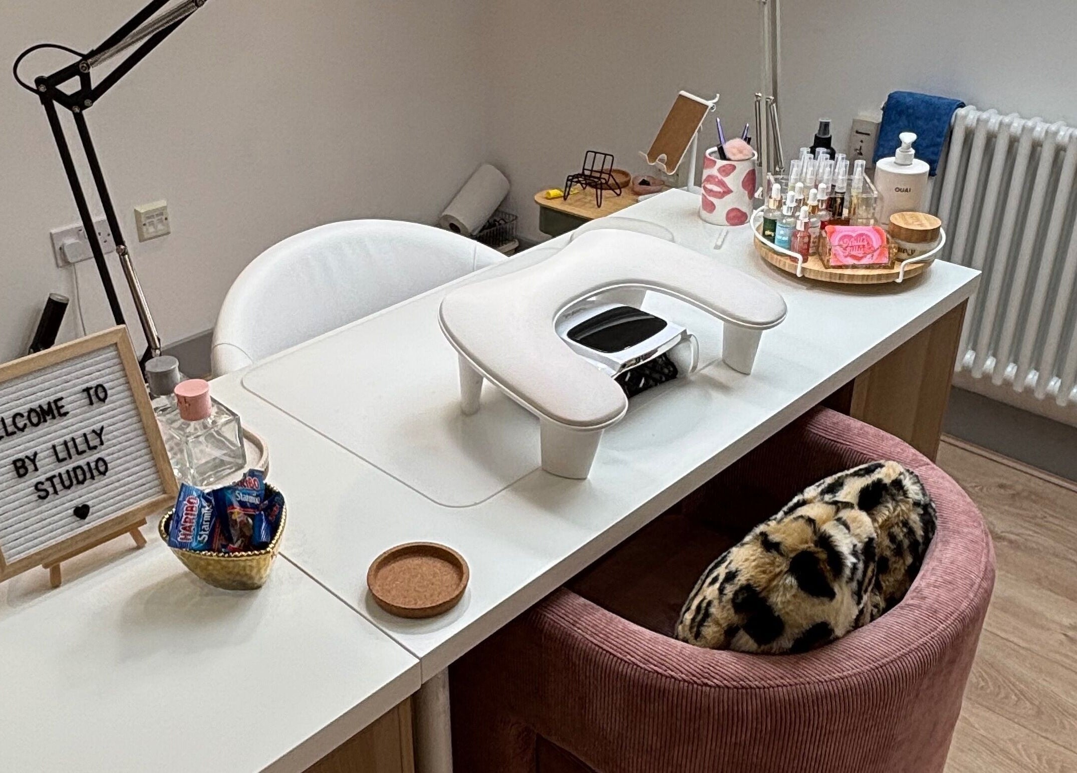 Elegant nail station at By Lilly Studio, Wilmslow, England, GB featuring stylish decor and beauty products.