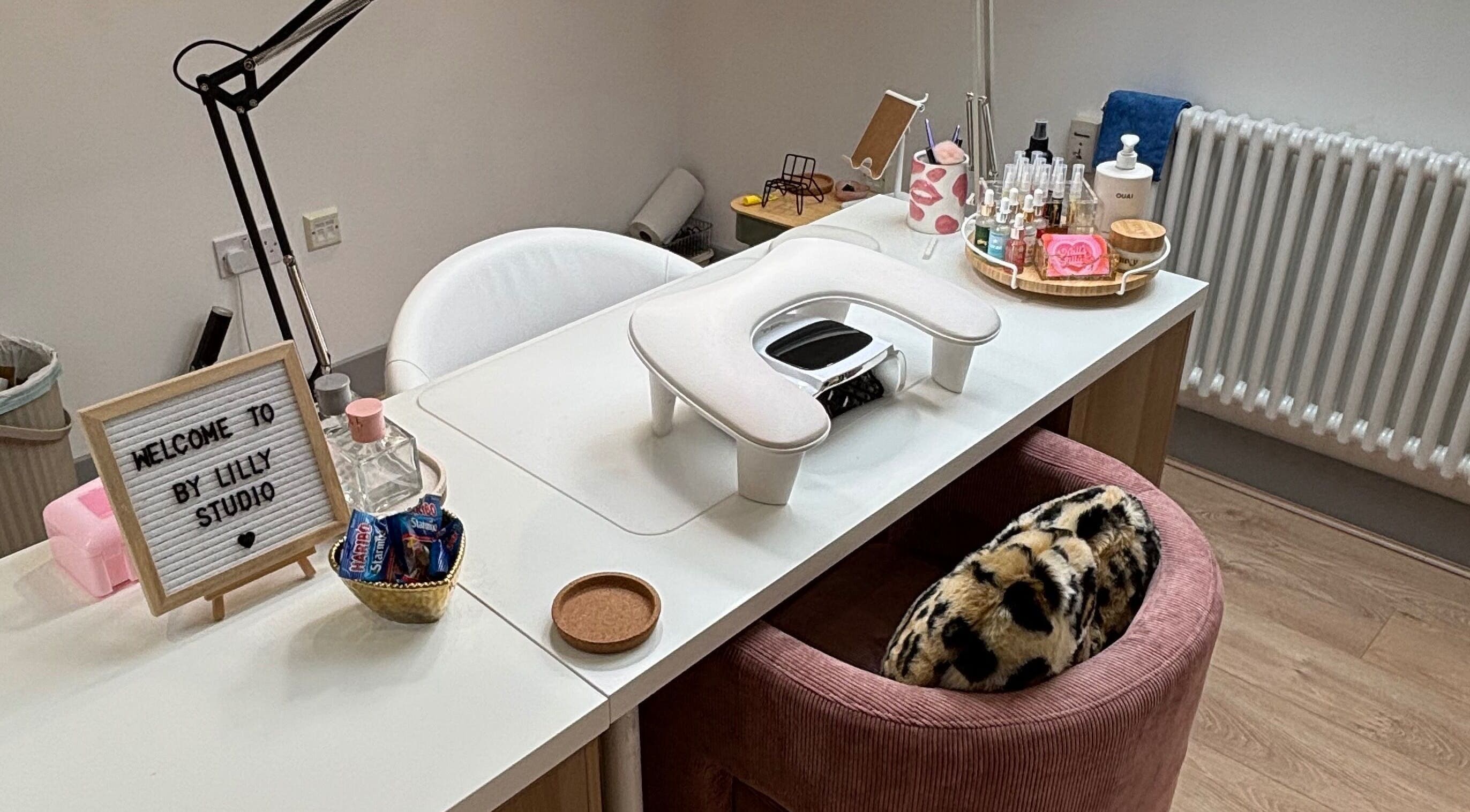 Elegant nail station at By Lilly Studio, Wilmslow, England, GB featuring stylish decor and beauty products.