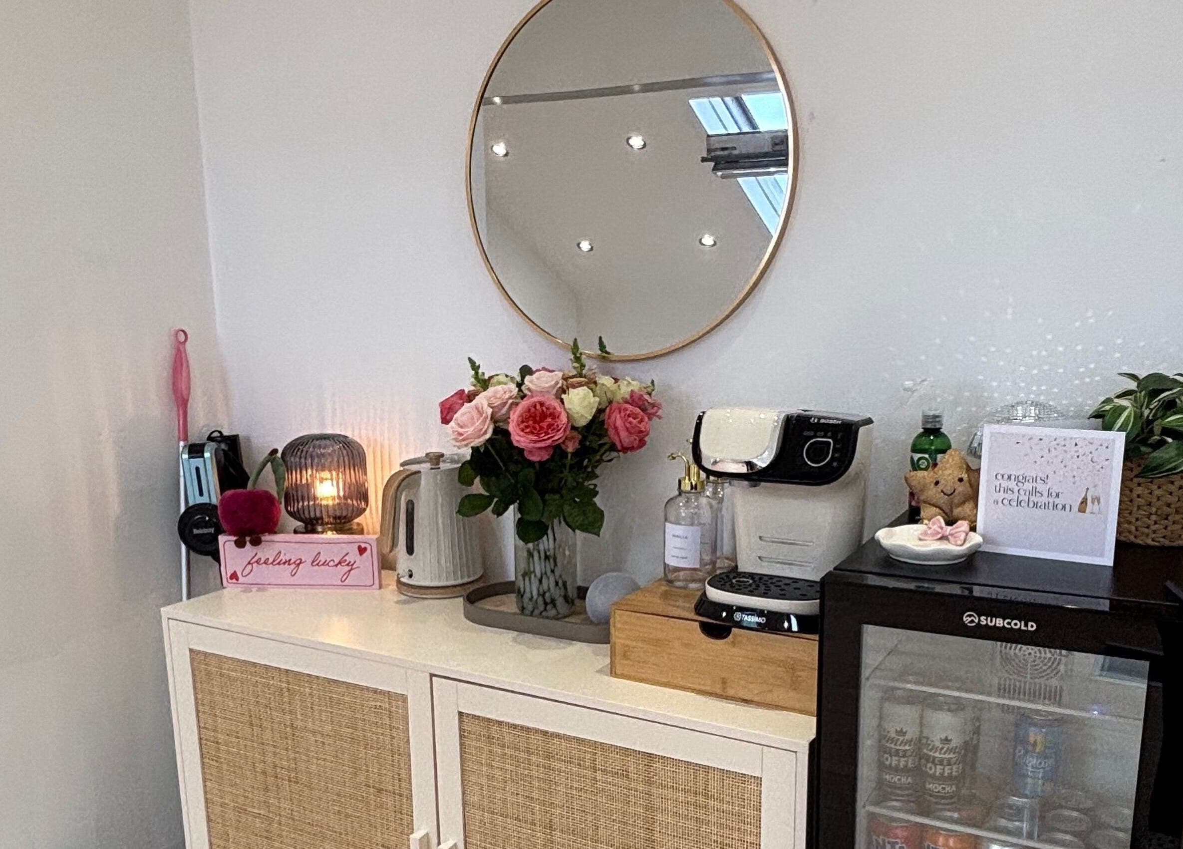 Chic beauty corner with mirror, flowers, and coffee maker at By Lilly Studio, Wilmslow, England, GB.